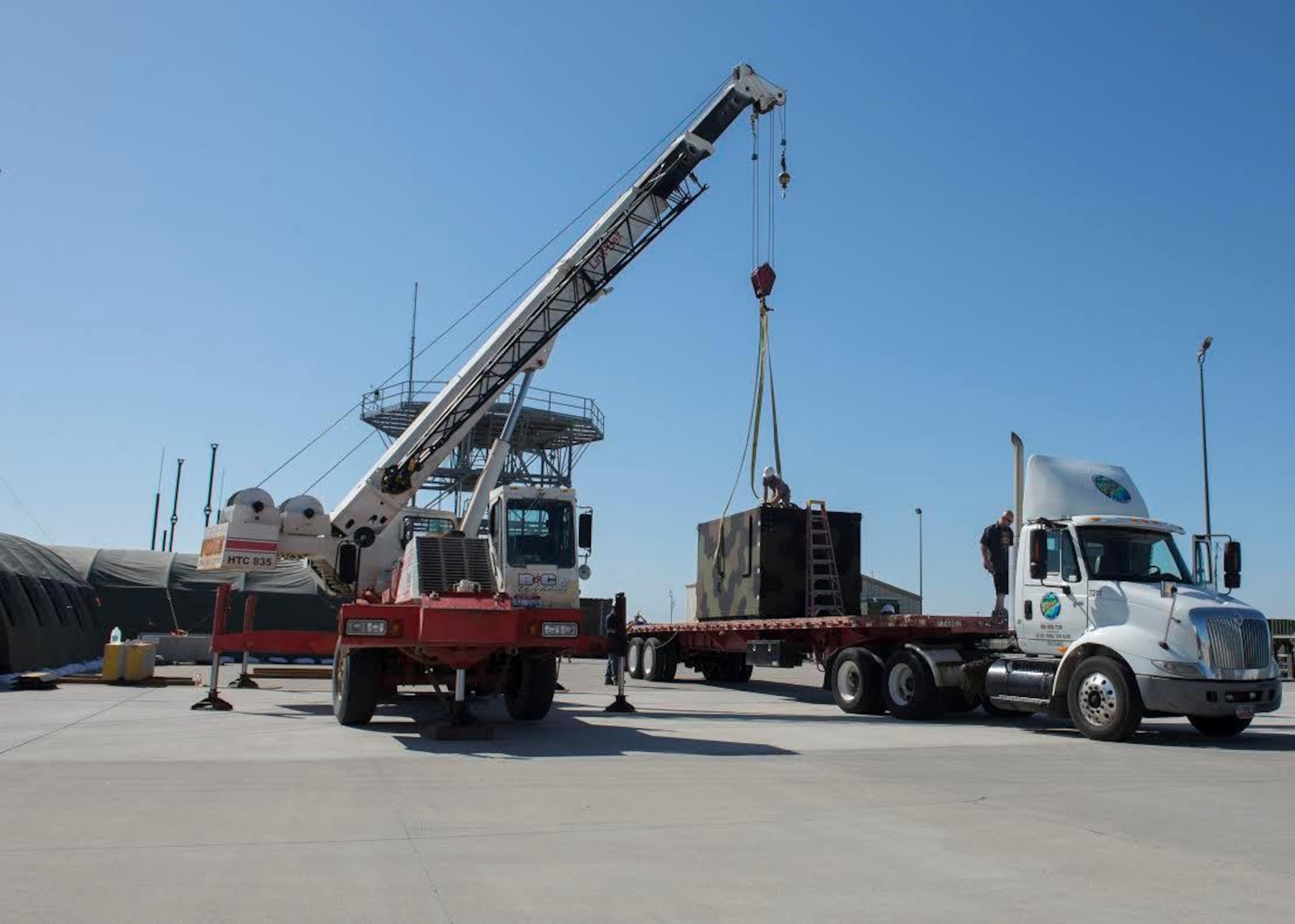 Airman from the 726th Air Control Squadron unload the TYQ-23A Control and Reporting Center May 30, 2017, at Mountain Home Air Force Base, Idaho. This is the first major weapons system upgrade the 726th has received in 20 years. (U.S. Air Force photo by Airman 1st Class Jeremy D. Wolff/Released)