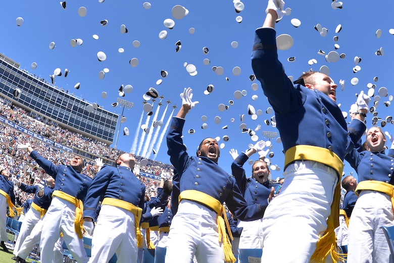 Newly-minted Air Force second lieutenants toss their hats in the air at the end of the Class of 2017 graduation ceremony, May 24, 2017, at the U.S. Air Force Academy. Three former members of the 302nd Airlift Wing were part of the graduating class. (U.S. Air Force photo/Bill Evans)