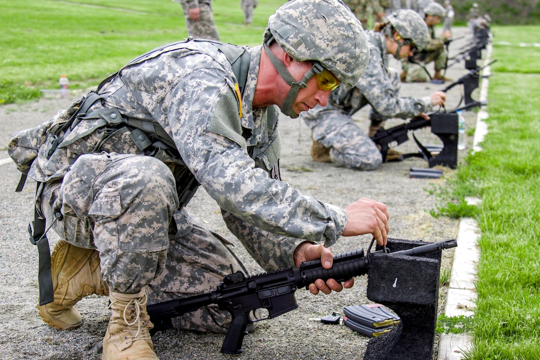 New York Army National Guard Spc. Michael Burton calibrates an M4 carbine before a competition at Camp Smith Training Site, N.Y., June 2, 2017. Burton is a chaplain assistant assigned to the 53rd Troop Command. The guardsmen and state militia competed in the 38th annual Adjutant General's Combat Sustainment Training Exercise Match, promoting excellence in marksmanship and weapon systems skills in a battle-focused environment. Army National Guard photo by Spc. Jonathan Pietrantoni