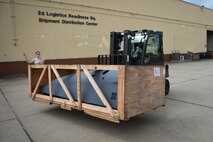 Airman Kylee Boice, 2nd Logistics Readiness Squadron Traffic Management Office receiving technician, spots Staff Sgt. Wesley Ramsey, 2nd LRS TMO NCOIC receiving, in offloading a B-52 cowling from a commercial flatbed trailer at Barksdale Air Force Base, La., June 6, 2017. Most shipments TMO receives come from depots with repaired aircraft parts.  (U.S. Air Force photo/Airman 1st Class Stuart Bright)