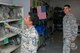 Col. Eric Shafa, 42nd Air Base Wing commander, and Chief Master Sgt. Erica Shipp, 42nd ABW command chief, look over equipment used for deployment training during a visit with the 42nd Logistics Readiness Squadron, June 6, 2016, Maxwell Air Force Base, Ala. During their visit, Shafa and Shipp learned the various aspects of the 42nd LRS.(US Air Force photo/Bud Hancock) 