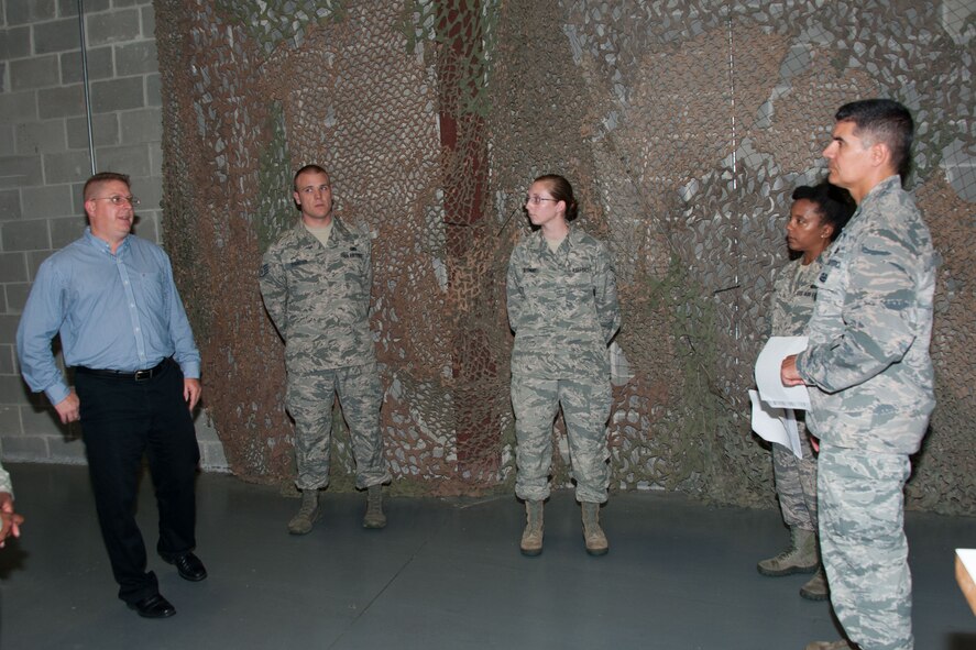 Col. Eric Shafa, 42nd Air Base Wing commander and Chief Master Sgt. Erica Shipp, 42nd ABW command chief, receive a brief by 42nd Logistics Readiness Squadron personal, June 6, 2016, Maxwell Air Force Base, Ala. During their visit with the squadron, Shafa and Ship were briefed on deployment requirements and issues.(US Air Force photo/Bud Hancock)