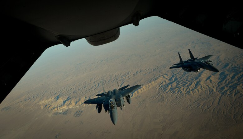 Two U.S. Air Force F-15E Strike Eagles fly in formation after receiving fuel from a 908th Expeditionary Air Refueling Squadron KC-10 Extender during a flight in support of Operation Inherent Resolve June 2, 2017. The F-15E Strike Eagle is a dual-role fighter designed to perform air-to-air and air-to-ground missions. An array of avionics and electronics systems gives the F-15E the capability to fight at low altitude, day or night, and in all weather. (U.S. Air Force photo by Staff Sgt. Michael Battles)