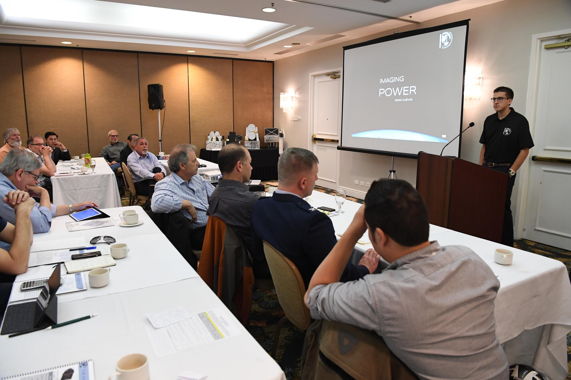 Panelists from the U.S. Department of Defense and commercial space industry listen as California Polytechnic University aerospace engineering students present their satellite design capstone project during a satellite design conference hosted by Cal Poly in Shell Beach, California, June 2, 2017.  The students were responding to a notional solicitation from a fictitious customer that outlined design specifications for a communications and earth-imaging satellite. (U.S. Air Force photo by Capt. Nicholas Mercurio/Released)