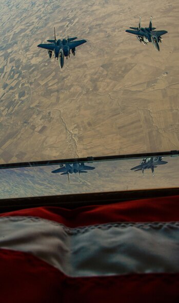 Two U.S. Air Force F-15E Strike Eagles fly in formation after receiving fuel from a 908th Expeditionary Air Refueling Squadron KC-10 Extender during a flight in support of Operation Inherent Resolve June 2, 2017. The F-15E Strike Eagle is a dual-role fighter designed to perform air-to-air and air-to-ground missions. An array of avionics and electronics systems gives the F-15E the capability to fight at low altitude, day or night, and in all weather. (U.S. Air Force photo by Staff Sgt. Michael Battles)