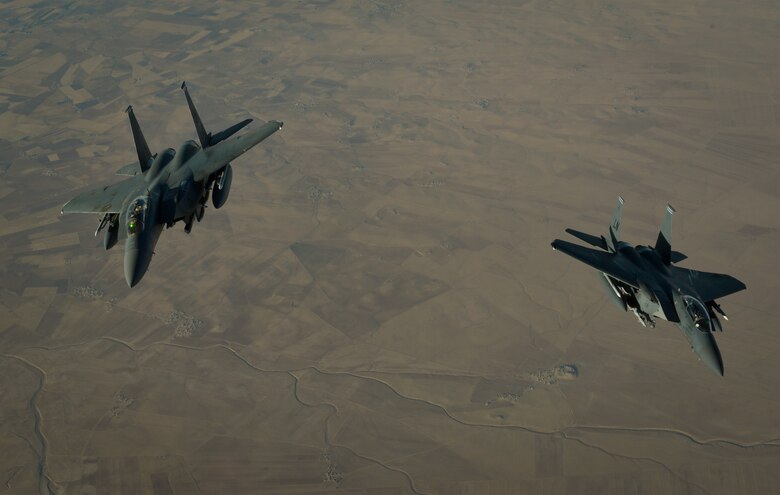 Two U.S. Air Force F-15E Strike Eagles depart after receiving fuel from a 908th Expeditionary Air Refueling Squadron KC-10 Extender during a flight in support of Operation Inherent Resolve June 2, 2017. The F-15E Strike Eagle is a dual-role fighter designed to perform air-to-air and air-to-ground missions. An array of avionics and electronics systems gives the F-15E the capability to fight at low altitude, day or night, and in all weather. (U.S. Air Force photo by Staff Sgt. Michael Battles)