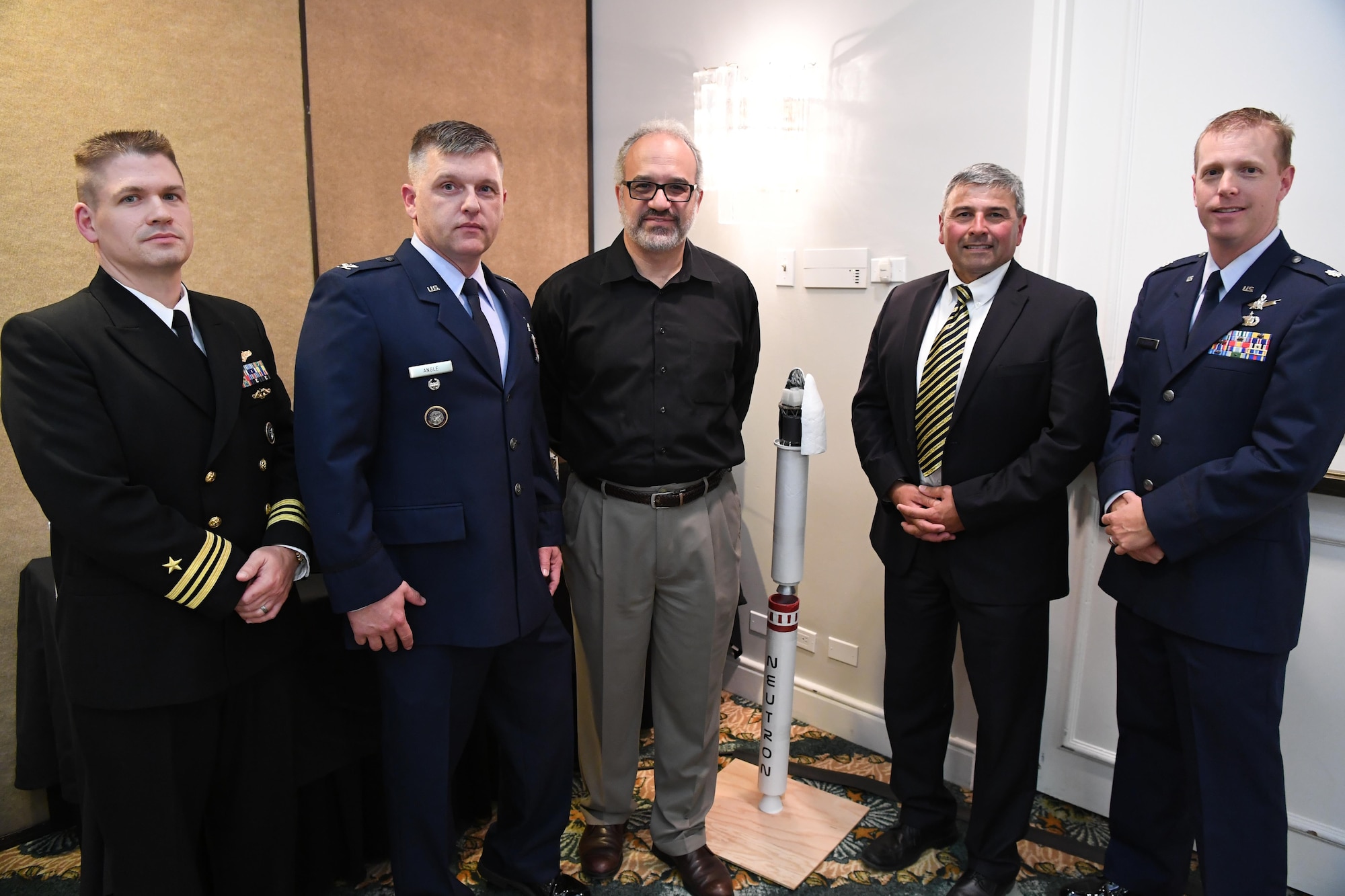 Representatives of the Joint Functional Component Command for Space, 14th Air Force (Air Forces Strategic) and Operationally Responsive Space office from Vandenberg Air Force Base, California, pose for a group photo with California Polytechnic University staff during a satellite design conference hosted by Cal Poly in Shell Beach, California, June 2, 2017.  The conference focused on the presentation of the aerospace engineering student capstone project to assembled military and industry space experts. (U.S. Air Force photo by Capt. Nicholas Mercurio/Released)