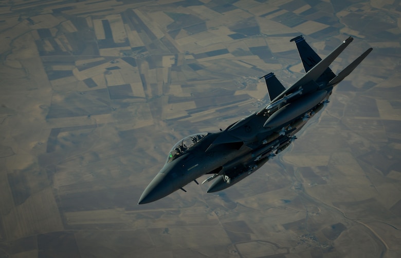 A U.S. Air Force F-15E Strike Eagle departs after receiving fuel from a 908th Expeditionary Air Refueling Squadron KC-10 Extender during a flight in support of Operation Inherent Resolve June 2, 2017. The F-15E Strike Eagle is a dual-role fighter designed to perform air-to-air and air-to-ground missions. An array of avionics and electronics systems gives the F-15E the capability to fight at low altitude, day or night, and in all weather. (U.S. Air Force photo by Staff Sgt. Michael Battles)