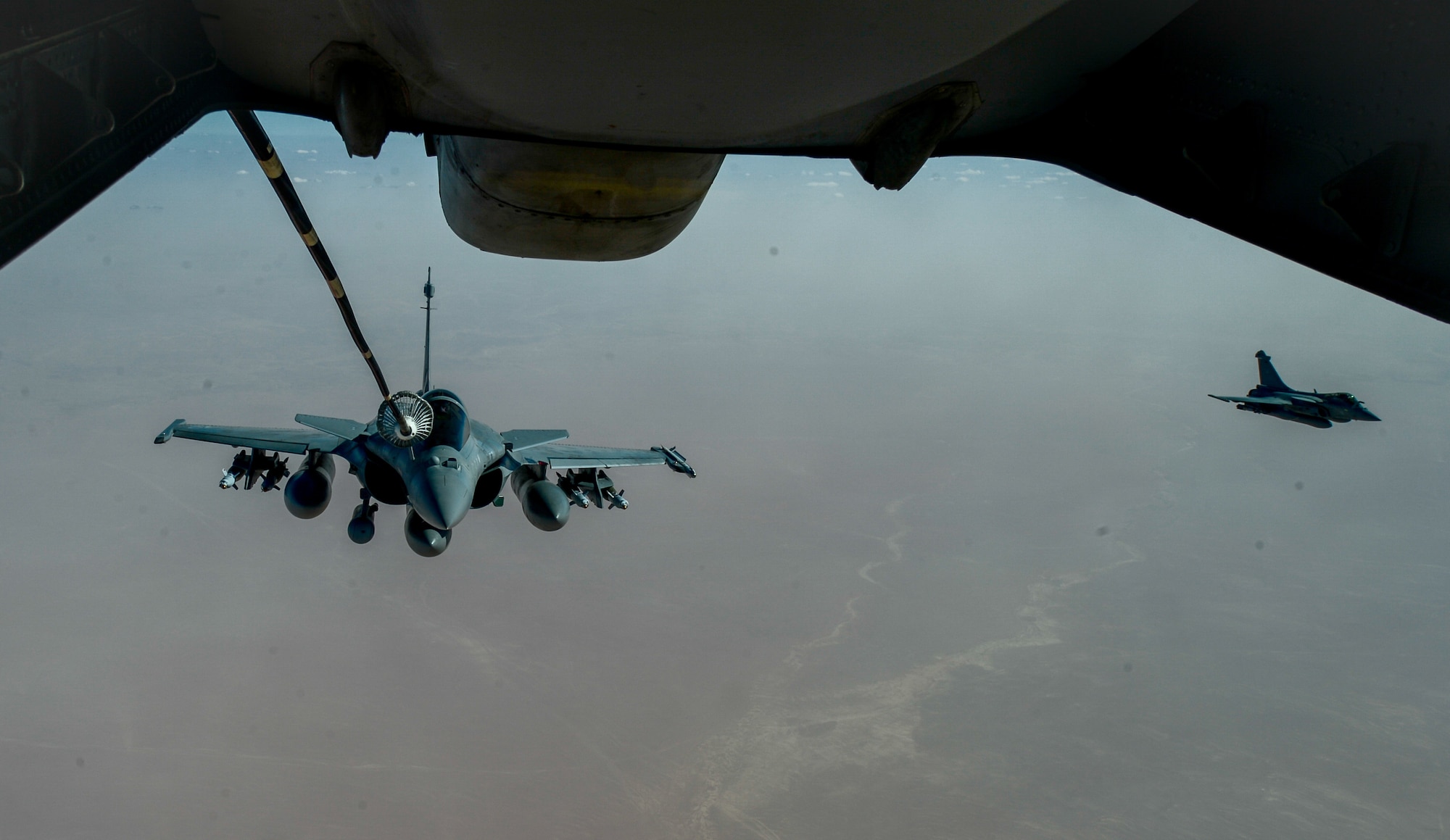 A French Naval Rafale receives fuel from a 908th Expeditionary Air Refueling Squadron KC-10 Extender during a flight in support of Operation Inherent Resolve June 2, 2017. Rafale is a French twin-engine, canard delta wing, multirole fighter aircraft with a wide range of weapons. The Rafale is intended to perform air supremacy, interdiction, aerial reconnaissance, ground support, in-depth strike and anti-ship strike missions. (U.S. Air Force photo by Staff Sgt. Michael Battles)