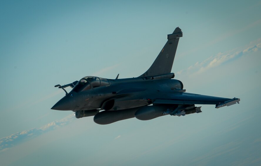 A French Naval Rafale departs after receiving fuel from a 908th Expeditionary Air Refueling Squadron KC-10 Extender during a flight in support of Operation Inherent Resolve June 2, 2017. Rafale is a French twin-engine, canard delta wing, multirole fighter aircraft with a wide range of weapons. The Rafale is intended to perform air supremacy, interdiction, aerial reconnaissance, ground support, in-depth strike and anti-ship strike missions. (U.S. Air Force photo by Staff Sgt. Michael Battles)
