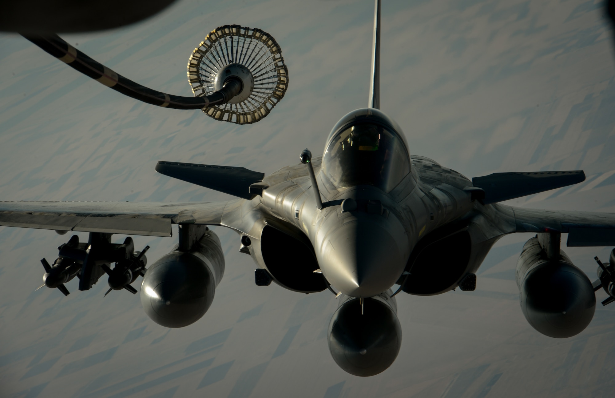 A French Naval Rafale departs after receiving fuel from a 908th Expeditionary Air Refueling Squadron KC-10 Extender during a flight in support of Operation Inherent Resolve June 2, 2017. Rafale is a French twin-engine, canard delta wing, multirole fighter aircraft with a wide range of weapons. The Rafale is intended to perform air supremacy, interdiction, aerial reconnaissance, ground support, in-depth strike and anti-ship strike missions. (U.S. Air Force photo by Staff Sgt. Michael Battles)