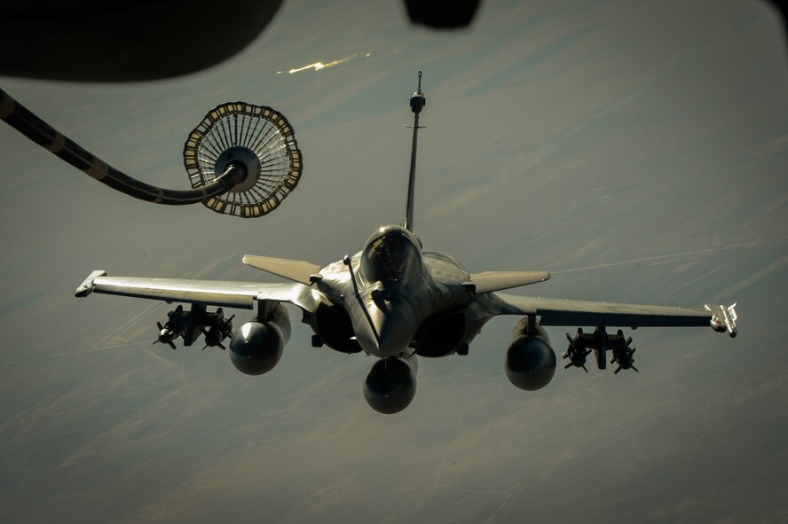 A French Naval Rafale departs after receiving fuel from a 908th Expeditionary Air Refueling Squadron KC-10 Extender during a flight in support of Operation Inherent Resolve June 2, 2017. Rafale is a French twin-engine, canard delta wing, multirole fighter aircraft with a wide range of weapons. The Rafale is intended to perform air supremacy, interdiction, aerial reconnaissance, ground support, in-depth strike and anti-ship strike missions. (U.S. Air Force photo by Staff Sgt. Michael Battles)