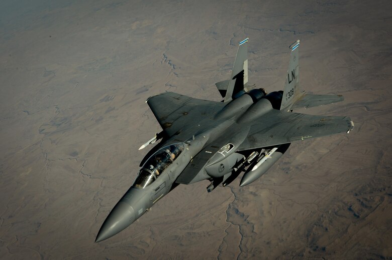 A U.S. Air Force F-15E Strike Eagle departs after receiving fuel from a 908th Expeditionary Air Refueling Squadron KC-10 Extender during a flight in support of Operation Inherent Resolve June 2, 2017. The F-15E Strike Eagle is a dual-role fighter designed to perform air-to-air and air-to-ground missions. An array of avionics and electronics systems gives the F-15E the capability to fight at low altitude, day or night, and in all weather. (U.S. Air Force photo by Staff Sgt. Michael Battles)