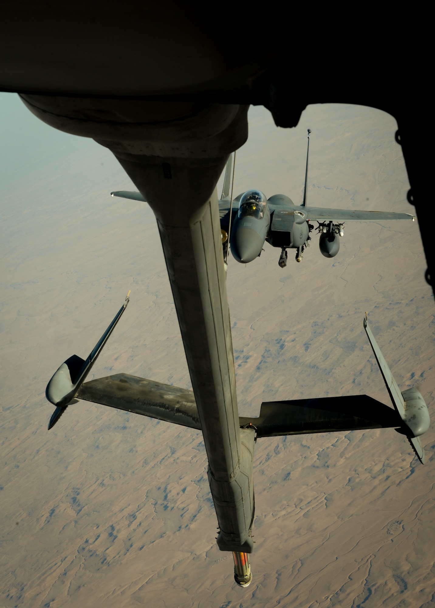 A U.S. Air Force F-15E Strike Eagle prepares to receive fuel from a 908th Expeditionary Air Refueling Squadron KC-10 Extender during a flight in support of Operation Inherent Resolve June 2, 2017. The F-15E Strike Eagle is a dual-role fighter designed to perform air-to-air and air-to-ground missions. An array of avionics and electronics systems gives the F-15E the capability to fight at low altitude, day or night, and in all weather. (U.S. Air Force photo by Staff Sgt. Michael Battles)