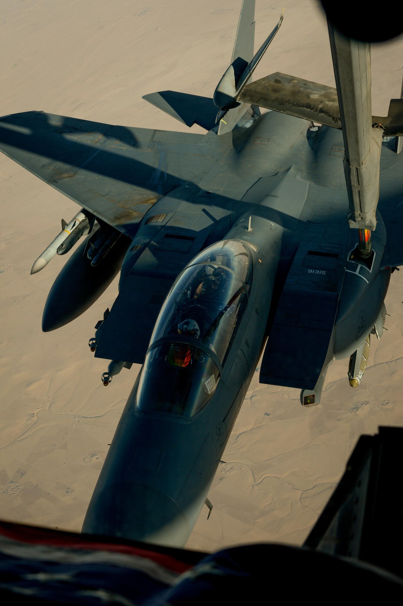 A U.S. Air Force F-15E Strike Eagle receives fuel from a 908th Expeditionary Air Refueling Squadron KC-10 Extender during a flight in support of Operation Inherent Resolve June 2, 2017. The F-15E Strike Eagle is a dual-role fighter designed to perform air-to-air and air-to-ground missions. An array of avionics and electronics systems gives the F-15E the capability to fight at low altitude, day or night, and in all weather. (U.S. Air Force photo by Staff Sgt. Michael Battles)
