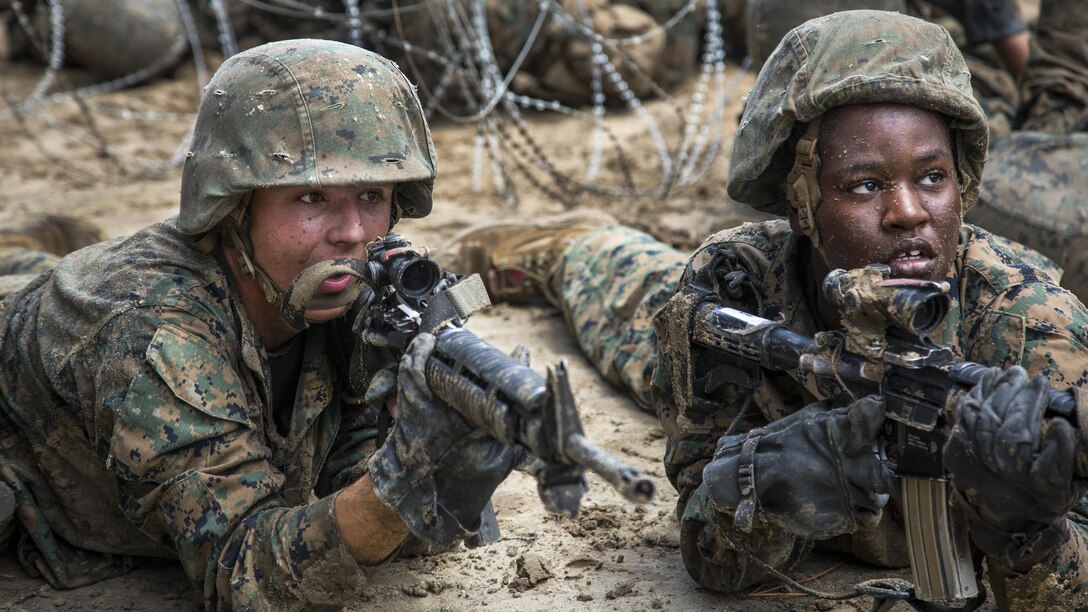 Marine Corps recruits Kyle Turner and Michelle Sajous post security during basic training at Marine Corps Recruit Depot, Parris Island, S.C.. June 6, 2017. The training teaches the importance of teamwork, working under stress and performing while using small-unit leadership.Turner and Sajous are assigned to Recruit Training Regiment. Marine Corps photo by Cpl. Richard Currier