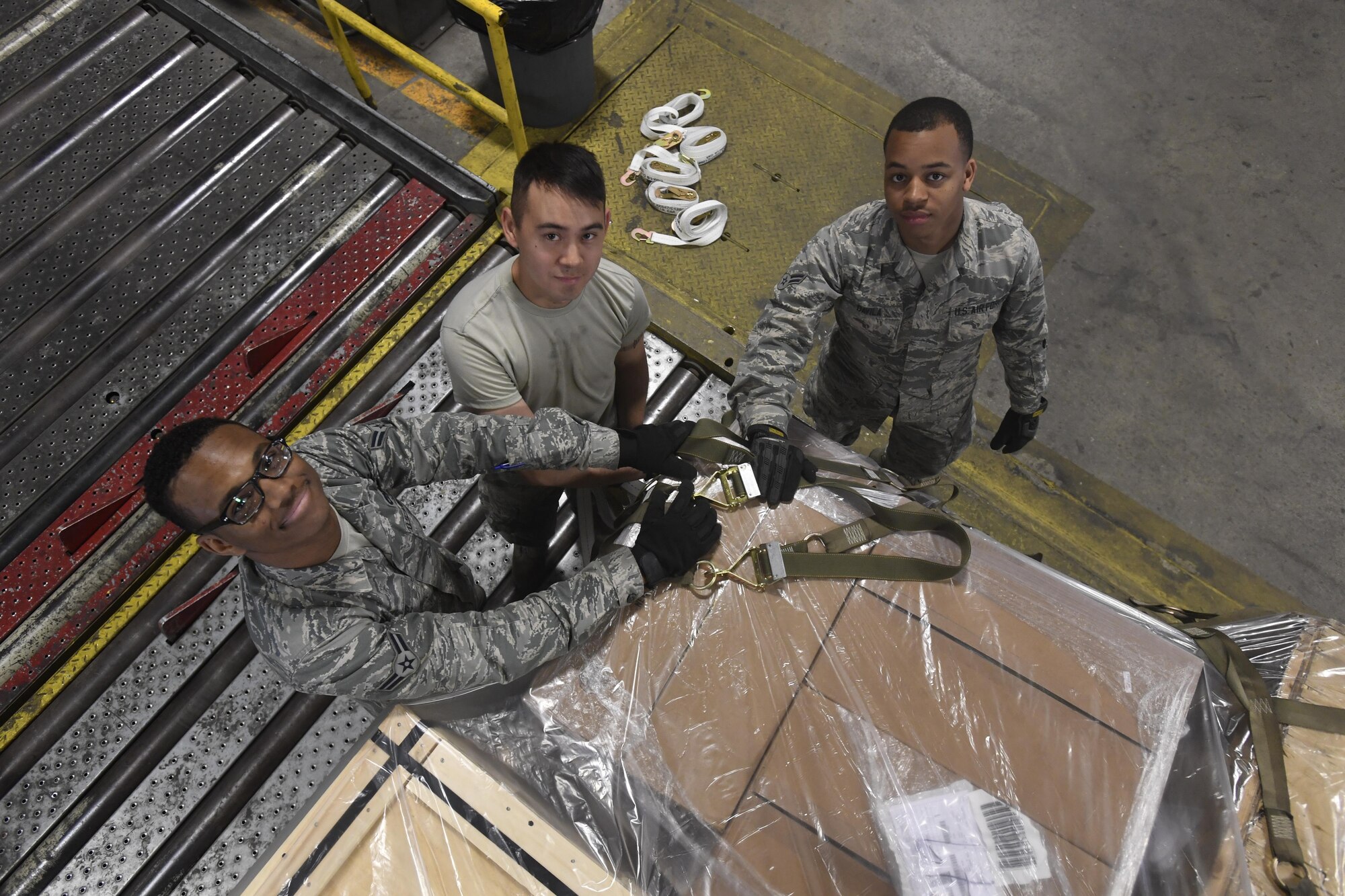 Airmen with the 305th Aerial Port Squadron prepare a pallet of cargo at Joint Base McGuire-Dix-Lakehurst, New Jersey, June 2, 2017. Mission essential cargo assembled by the Airmen is stored in the warehouse here prior to being shipped overseas. 