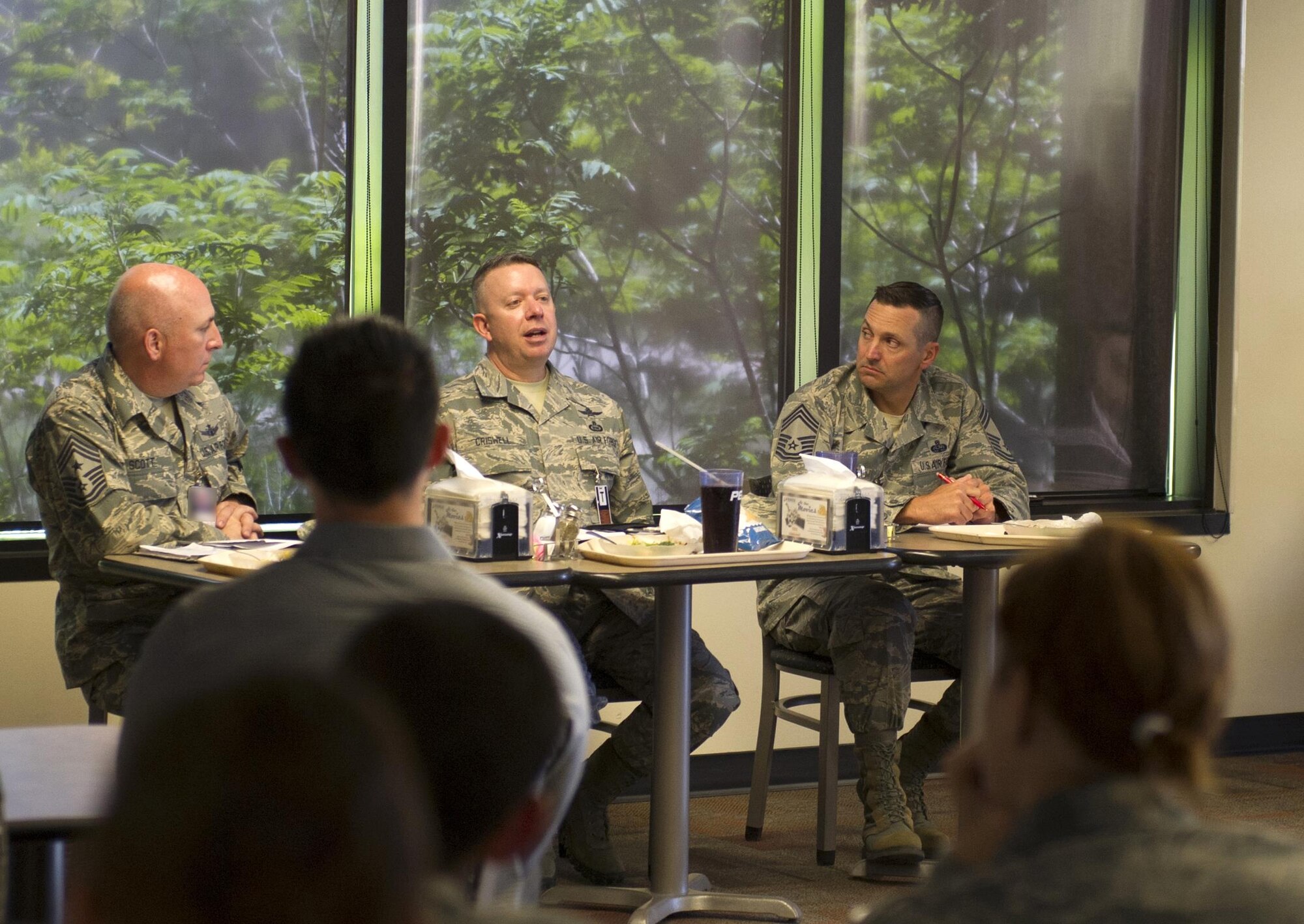 SCHRIEVER AIR FORCE BASE, Colo. -- Command Chief Master Sgt. Brendan Criswell and Individual Mobilization Augmentee Chief Master Sgt. James Burmeister, Air Force Space Command, accompany Command Chief Master Sgt. Todd Scott, 310th Space Wing, in leading a panel for enlisted personnel during the June Unit Training Assembly on Sunday, June 4th, 2017. The panel gave enlisted members the opportunity to ask the command chief's questions and inquire about upcoming changes to force structure. (U.S. Air Force photo/Staff Sgt. Christopher Moore)