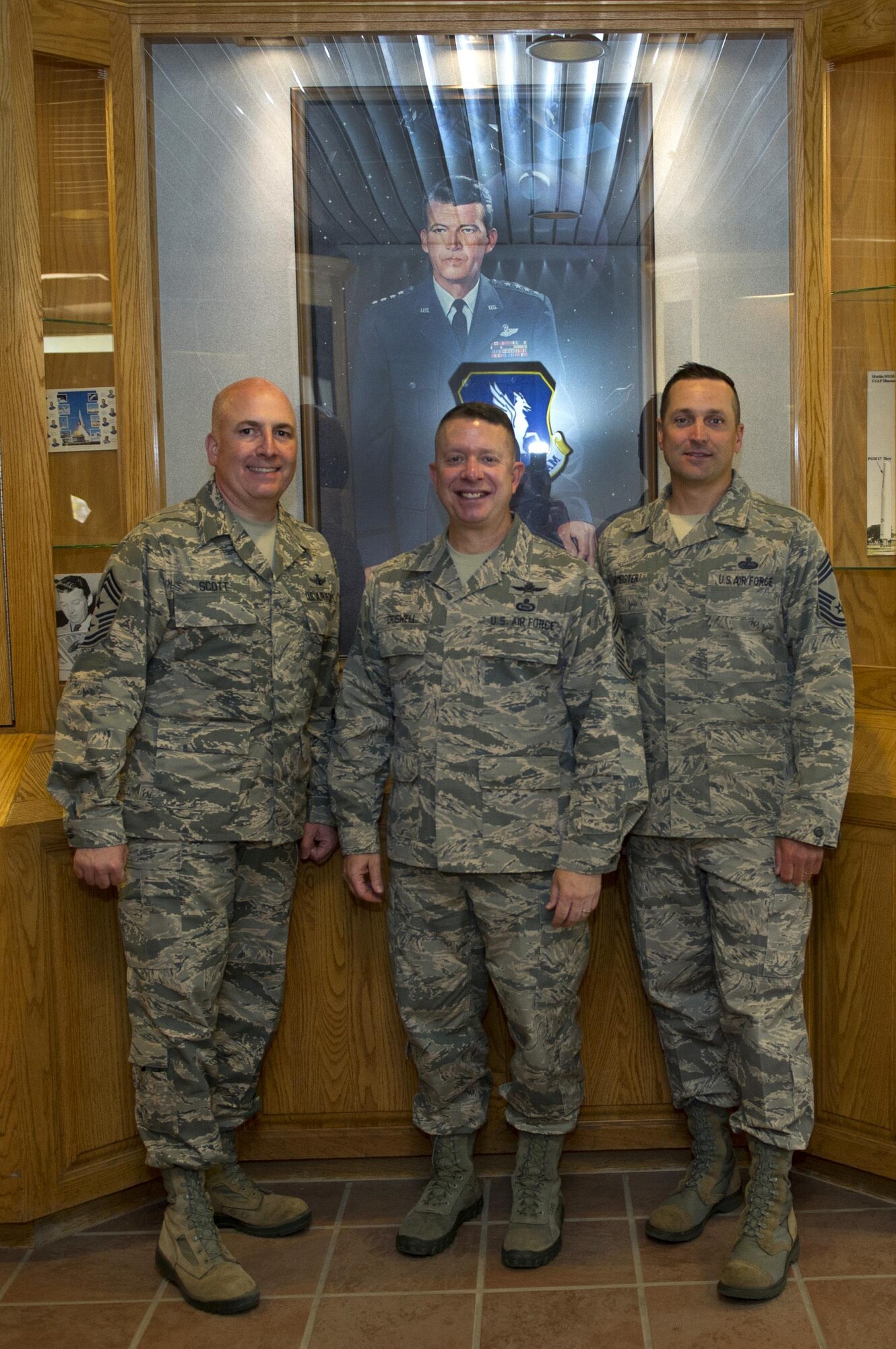 SCHRIEVER AIR FORCE BASE, Colo. -- Command Chief Master Sgt. Brendan Criswell and Individual Mobilization Augmentee Chief Master Sgt. James Burmeister, Air Force Space Command, accompany Command Chief Master Sgt. Todd Scott, 310th Space Wing, while posing for a group photo during the June Unit Training Assembly on Sunday, June 4th, 2017. The command chiefs were given a tour of squadrons within the wing to see how Citizen Airmen contribute to the daily Air Force mission. (U.S. Air Force photo/Staff Sgt. Christopher Moore)