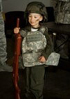 A child poses for a photo during Operation Heroes at Minot Air Force Base, N.D., June 3, 2017. Operation Heroes is an annual event hosted by the 5th Force Support Squadron that allows military children to undergo a mock deployment to help them better understand what their parents experience abroad. (U.S. Air Force photo/Senior Airman Sahara L. Fales)