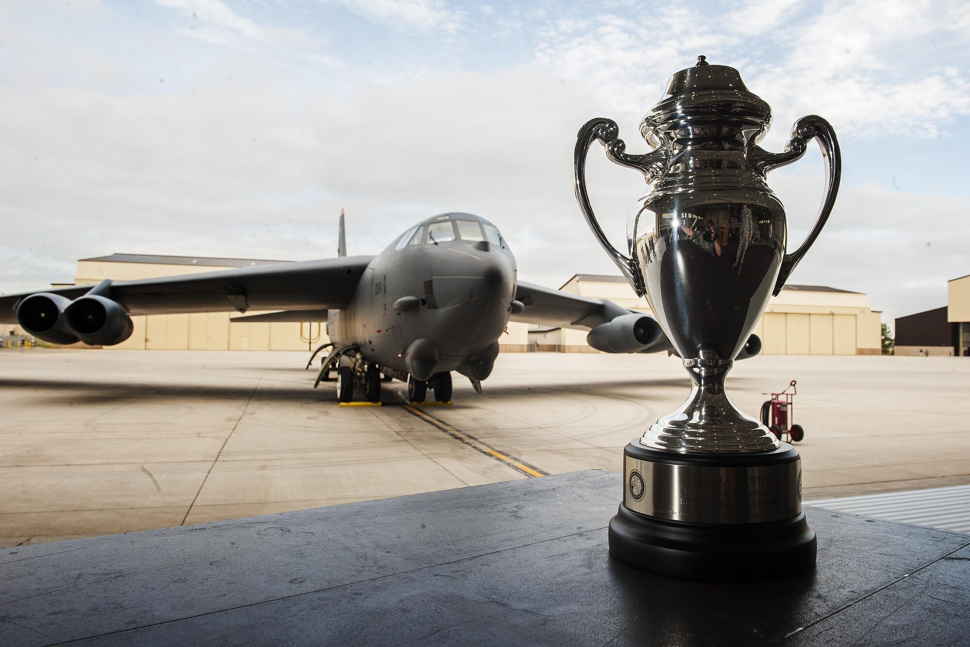 The Omaha Trophy stands in front of a B-52H Stratofortress at Minot Air Force Base, N.D., June 6, 2017. Gen. John E. Hyten, U.S. Strategic Command commander, presented the 5th Bomb Wing with the 2017 Omaha Trophy in the Strategic Bomber. (U.S. Air Force photo/Senior Airman J.T. Armstrong)
