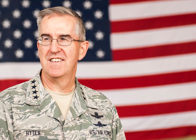 Gen. John E. Hyten, U.S. Strategic Command commander, stands in front of a flag at Minot Air Force Base, N.D., June 6, 2017. Hyten presented the 5th Bomb Wing with the 2017 Omaha Trophy in the Strategic Bomber category and recognized multiple Team Minot Airmen for their mission contributions. (U.S. Air Force photo/Senior Airman J.T. Armstrong)
