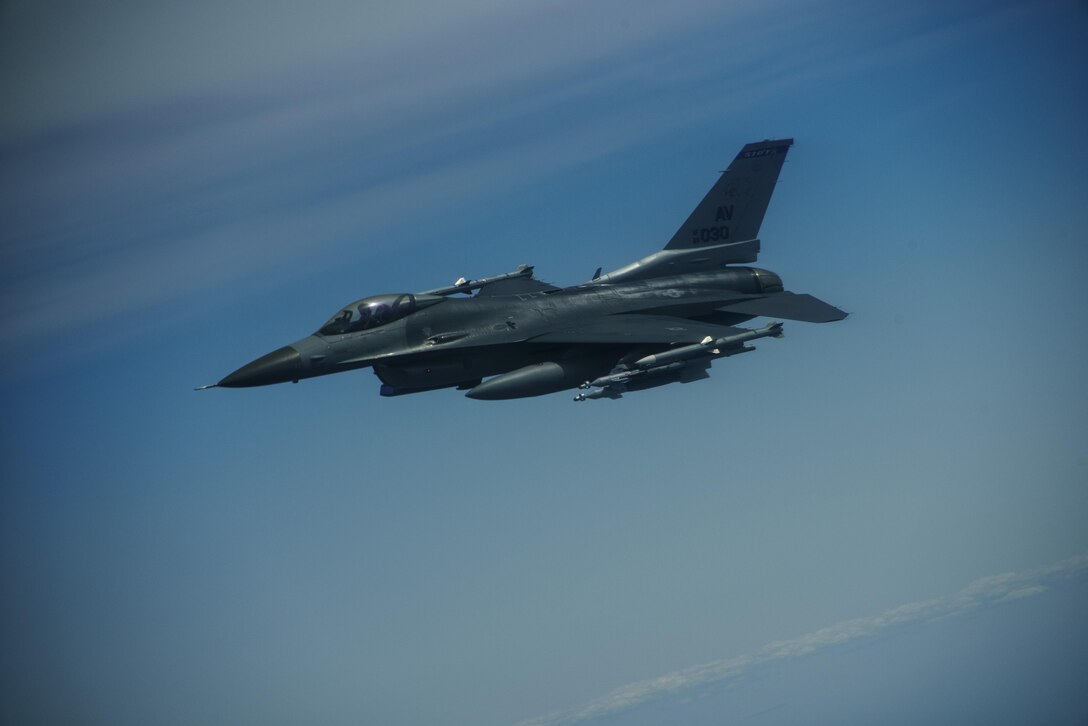 An F-16 Fighting Falcon, 510th Fighter Squadron, is deployed to Krzesiny Air Base, Poland, in support of Aviation
Detachment rotation 17-3, exercise BALTOPS and exercise Saber Strike flies over Latvia, June 7, 2017. The
exercise, is designed to enhance flexibility and interoperability, to strengthen combined response capabilities, as well as demonstrate resolve among Allied and Partner Nations' forces to ensure stability in, and if necessary defend, the Baltic Sea region. (U.S. Air Force photo by Staff Sgt. Jonathan Snyder)