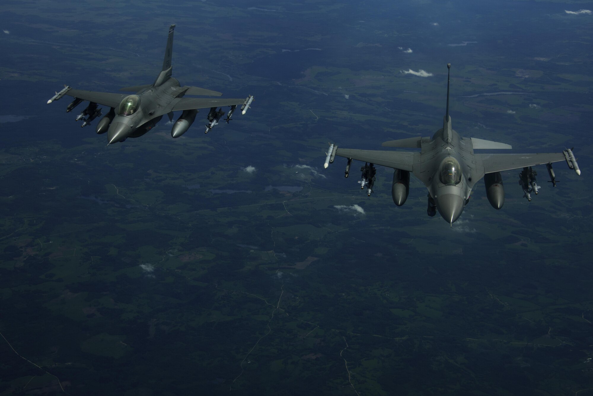 Two F-16 Fighting Falcons, 510th Fighter Squadron, are deployed to Krzesiny Air Base, Poland, in support of
Aviation Detachment rotation 17-3, exercise BALTOPS and exercise Saber Strike fly over Latvia, June 7, 2017. BALTOPS is an annually recurring multinational exercise designed to enhance flexibility and interoperability, as well
as demonstrate resolve of allied and partner forces to defend the Baltic region. Participating nations include Belgium, Denmark, Estonia, Finland, France, Germany, Latvia, Lithuania, the Netherlands, Norway, Poland, Sweden, the United Kingdom, and the United States. (U.S. Air Force photo by Staff Sgt. Jonathan Snyder)