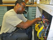 Senior Airman Darius Cotton, a 592nd Special Operations Maintenance Squadron aerospace ground equipment journeyman, conducts ohms checks on a portable electrical generator May 24, 2017 at Duke Field, Fla.  The squadron’s AGE flight provides fully mission-capable support equipment for all Duke aircraft and civil engineering requirements. (U.S. Air Force photo/Dan Neely)