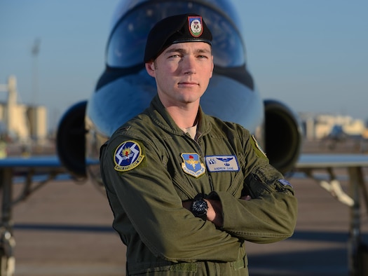 U.S. Air Force 2nd Lt. Andrew Dane, 47th Flying Training Wing pilot graduate, poses for a photo on the flight line at Laughlin Air Force Base, May 25, 2017. With his new wings, Dane is on his way to fly the F-16 Fighting Falcon, an aircraft that he formerly supported as a Tactical Air Control Party specialist. (U.S. Air Force photo/Airman 1st Class Benjamin N. Valmoja)