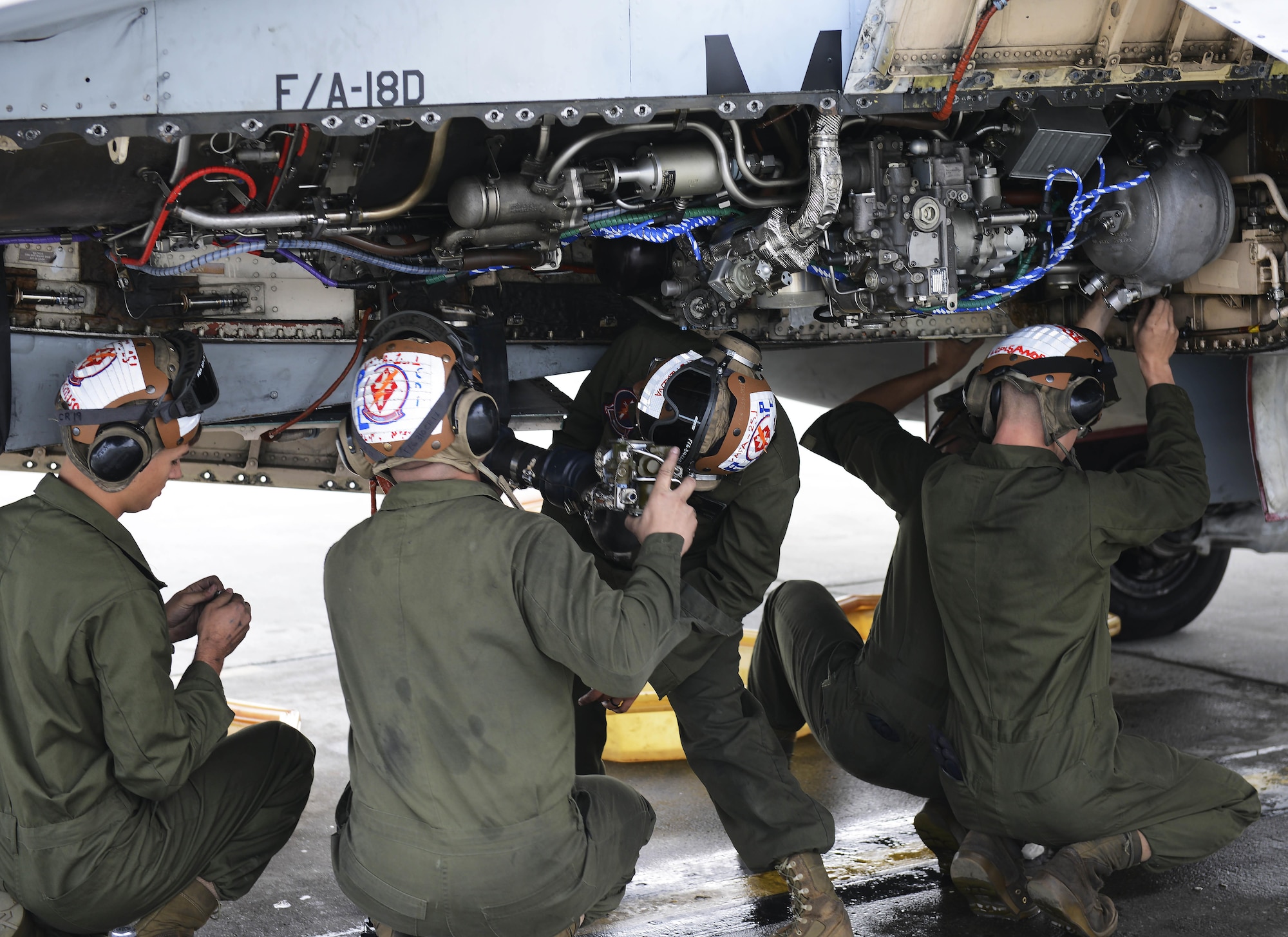 U.S. Marine Corps maintainers with Marine Fighter Attack Squadron 251 install a new motor on a Marine Corps F/A-18D Hornet, at Joint Base Elmendorf-Richardson, Alaska, June 7, 2017. VMFA-251, based out of South Carolina, is here participating in a joint exercise. 