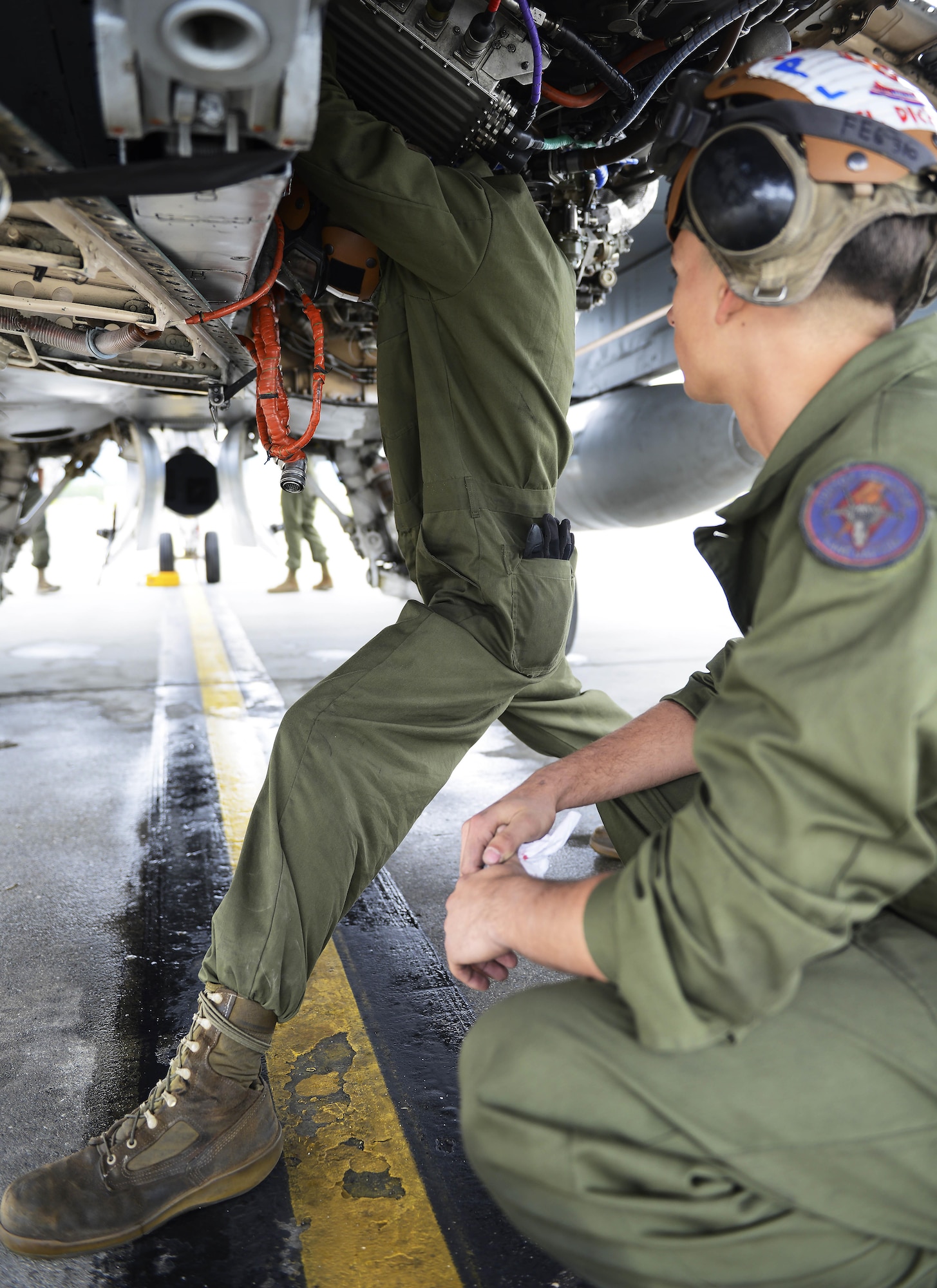 U.S. Marine Corps Lance Cpl. Brandon Sanders, maintainer with Marine Fighter Attack Squadron 251, installs a new motor on a Marine Corps F/A-18D Hornet, at Joint Base Elmendorf-Richardson, Alaska, June 7, 2017. VMFA-251, based out of South Carolina, is here participating in a joint exercise. 