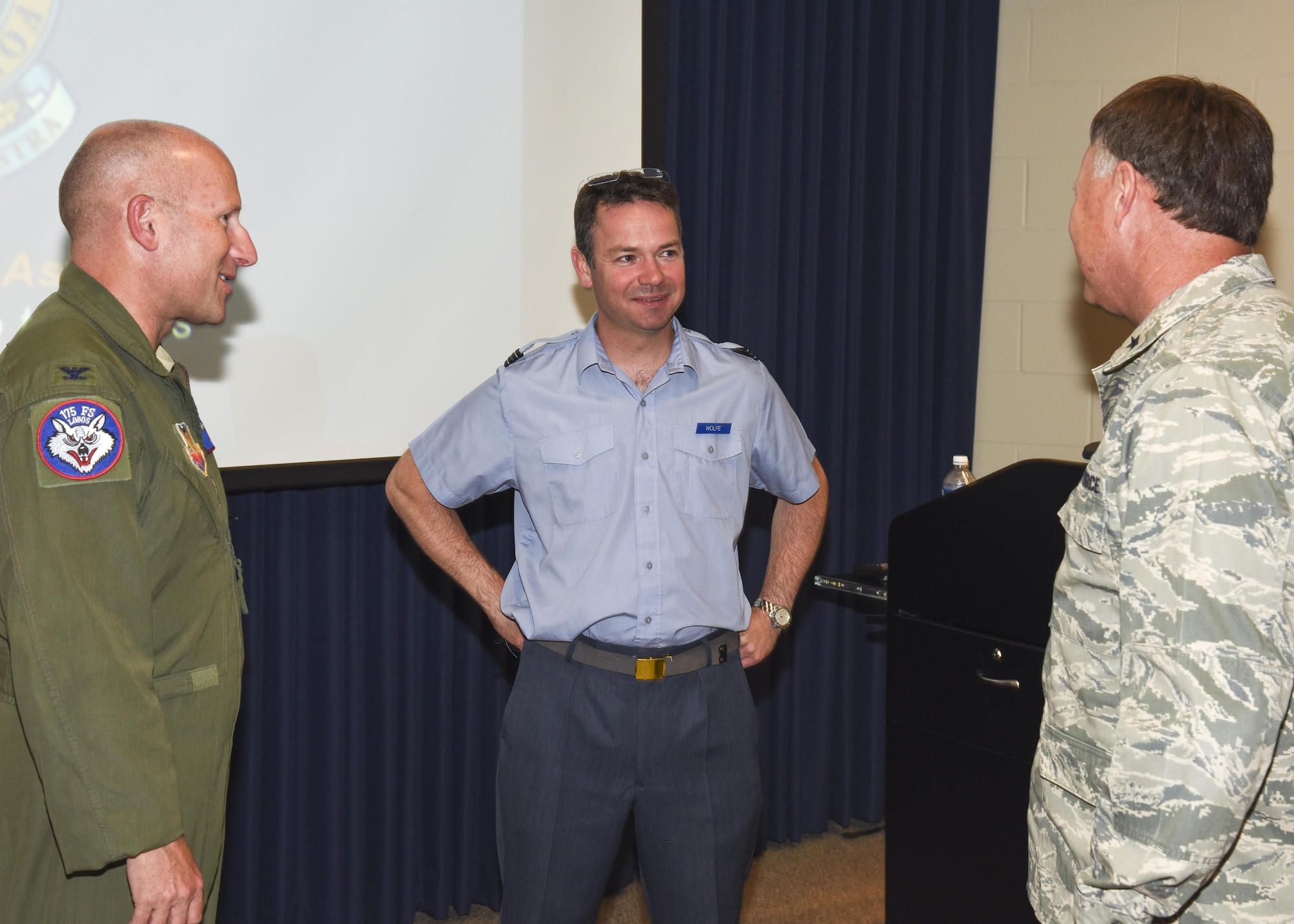 Flt. Lt. Andrew Wolfe, 607 Squadron (County of Durham) logistic officer, talks with Brig. Gen. Russ Walz, South Dakota National Guard director of joint staff, and Col. Gregory Lair, 114th Fighter Wing vice-commander, during his visit as part of the Military Reserve Exchange Program. MREP is a reciprocal exchange program which provides Guard and Reserve members, both officer and enlisted, the opportunity to train with select foreign allied nations and gain a better understanding how foreign powers operate. (U.S. Air National Guard photo by Tech. Sgt. Luke Olson/Released)