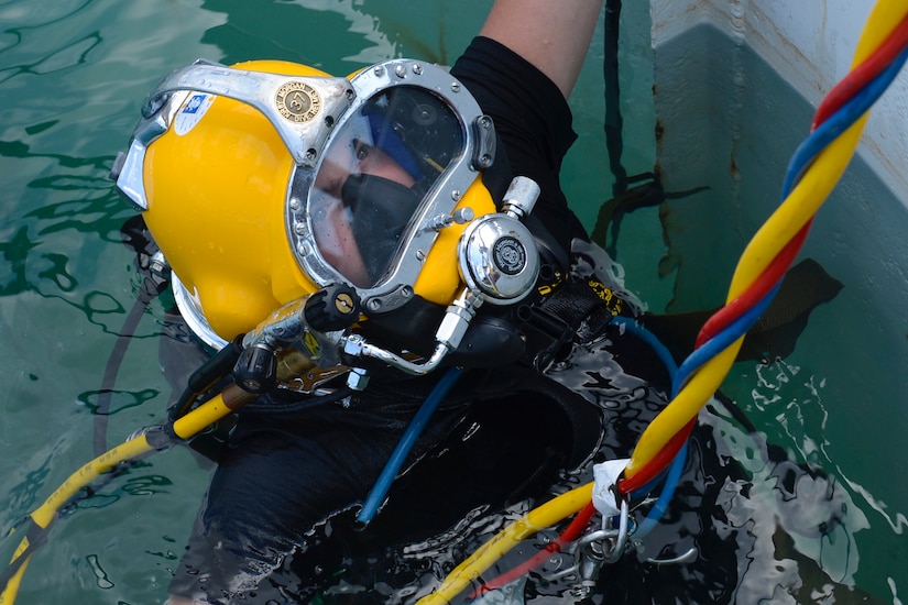 U.S. Army Pfc. James Lewis, 30th Engineer Battalion, 20th Eng. Brigade, 74th Eng. Dive Detachment second-class diver, waits at the surface of a dive-tank for instructions during training at Joint Base Langley-Eustis, Va., June 6, 2017. Lewis, a stand-by diver, practiced rescuing a fellow diver during the training to upgrade his team’s proficiency as a unit. (U.S. Air Force photo/Airman 1st Class Kaylee Dubois)