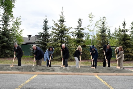 (left to right) Brian Gawne, Vice President of Community Relations, Fisher House Foundation; Terry Parks, President of the Fisher House of Alaska Board; Mary Considine, Chief of Staff, Fisher House Foundation;  Morton Plumb, Secretary of Treasurer of the Fisher House of Alaska Board; Cindy Wilsbach, Fisher House of Alaska Board member; Air Force Lt. Gen. Ken Wilsbach, Alaskan North American Aerospace Defense Command Region, Alaskan Command, and Eleventh Air Force commander; Ed Ford, Social Work Executive to Alaska Veteran Affairs Healthcare, and Jenny Hall, Fisher House manager; dig in during a groundbreaking ceremony for the Fisher House II June 6, 2017 at Joint Base Elmendorf-Richardson. The new facility is scheduled for completion in Spring 2018. (U.S. Air Force photo by Staff Sgt. Sheila deVera)

