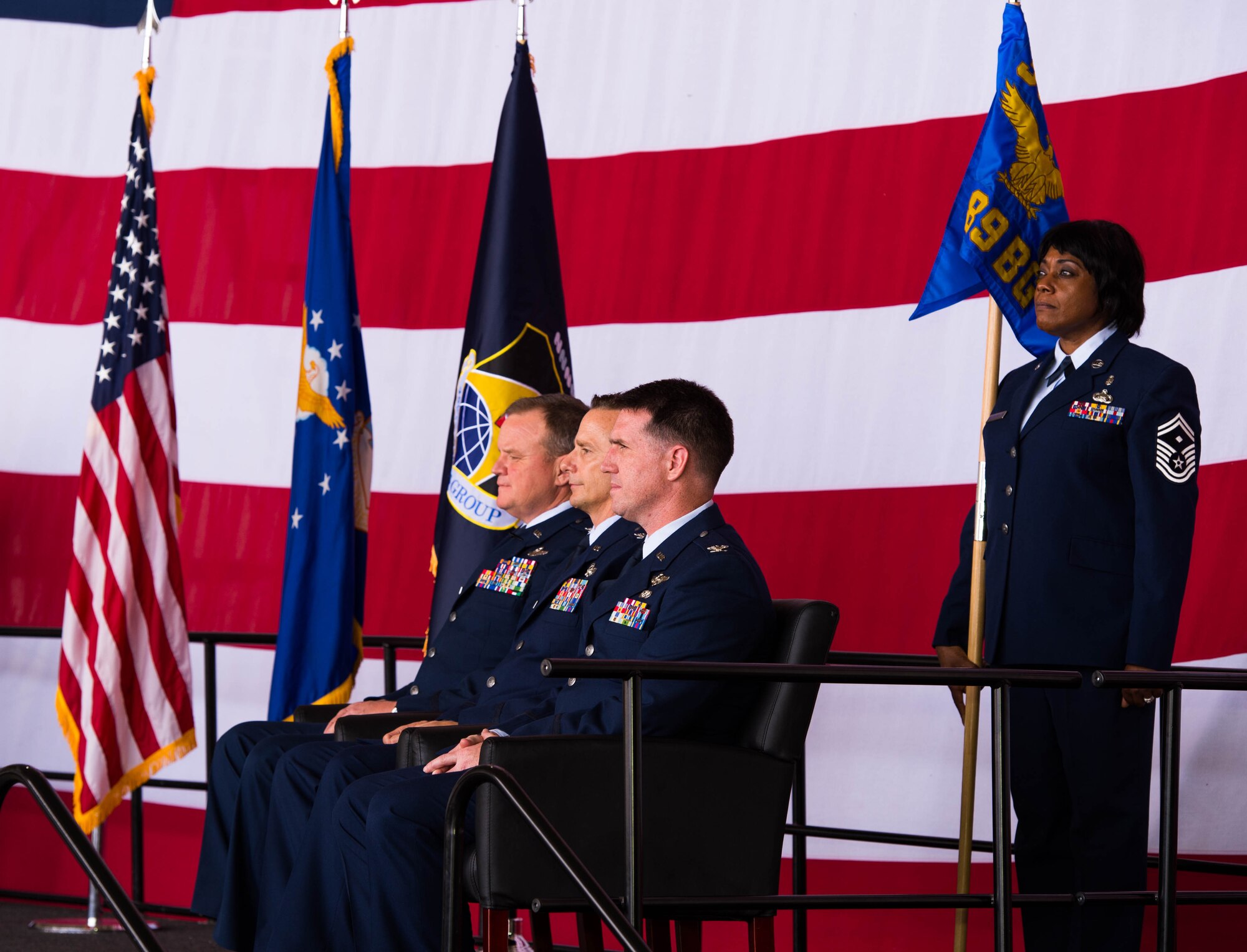Col. Bruce Cox, 307th Bomb Wing commander, Col. Denis Heinz, 489th Bomb Wing outgoing commander, Col. Michael McClanahan incoming commander and Senior Master Sgt. Linda Mason Wilson, the 489th Bomb Group first sergeant, wait for the start of the change of command ceremony at Dyess Air Force Base, Texas, June 3, 2017. The 307th Bomb Wing is the only dual-bomber wing in the Air Force, operating both the B-52 Stratofortress and B-1 Lancer. (U.S. Air Force photo by Staff Sgt. Jason McCasland/Released)