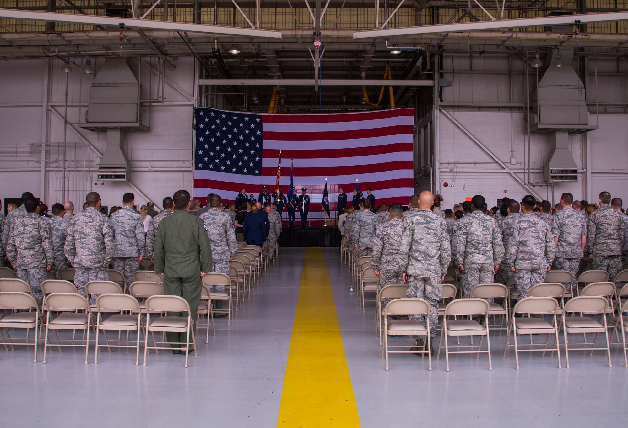 Airmen of the 489th Bomb Group stand at attention during the presentation of the colors at Dyess Air Force Base, Texas, June 3, 2017. Col. Michael McClanahan assumed command from Col. Denis Heinz during the ceremony. (U.S. Air Force photo by Staff Sgt. Jason McCasland/Released)