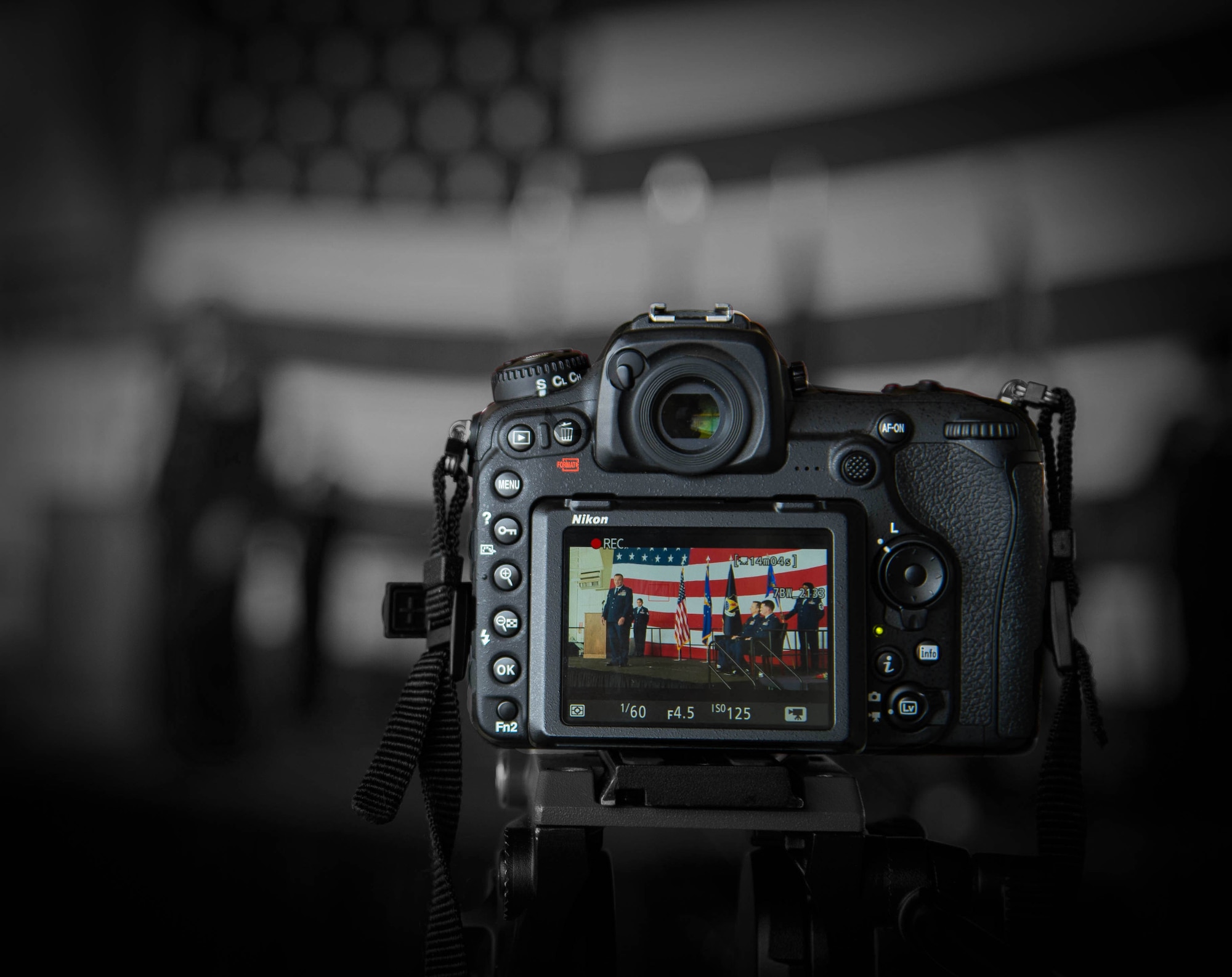 A video camera records the change of command ceremony at Dyess Air Force Base, Texas, June 3, 2017. The change of command Ceremony dates back to the 18th Century, where unit flags were handed off between the outgoing and incoming commanders. The ceremony concludes with the new commander stating to the presiding official, “Sir, I assume command.” (U.S. Air Force photo by Staff Sgt. Jason McCasland/Released)