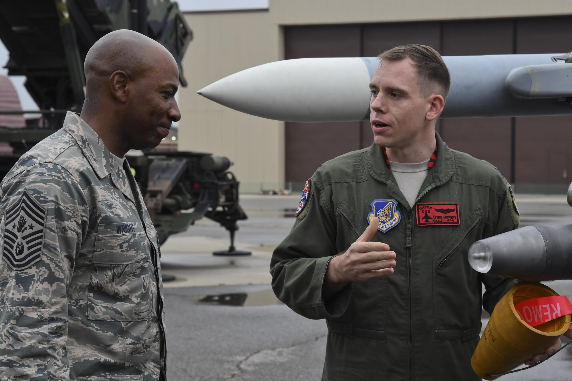 Capt. Wayne Mowery 36th Fighter Squadron pilot, briefs Chief Master Sgt. of the Air Force Kaleth O. Wright on the F-16 Fighting Falcon’s weapon systems by at Osan Air Base, Republic of Korea, June 7, 2017. The visit gave Wright the opportunity to interact with Airmen across the base, discuss concerns among the enlisted force and see the 51st Fighter Wing’s “Fight Tonight” capabilities. (U.S. Air Force photo by Airman 1st Class Gwendalyn Smith/Released)