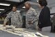 Staff Sgt. Joshua Jenkins, 51st Operations Support Squadron, briefs Chief Master Sgt. of the Air Force Kaleth O. Wright on flight crew equipment at Osan Air Base, Republic of Korea, June 7, 2017. Wright’s visit was an opportunity to interact with Airmen across the base, discuss concerns among the enlisted force and see the 51st Fighter Wing’s “Fight Tonight” capabilities. (U.S. Air Force photo by Airman 1st Class Gwendalyn Smith/Released)