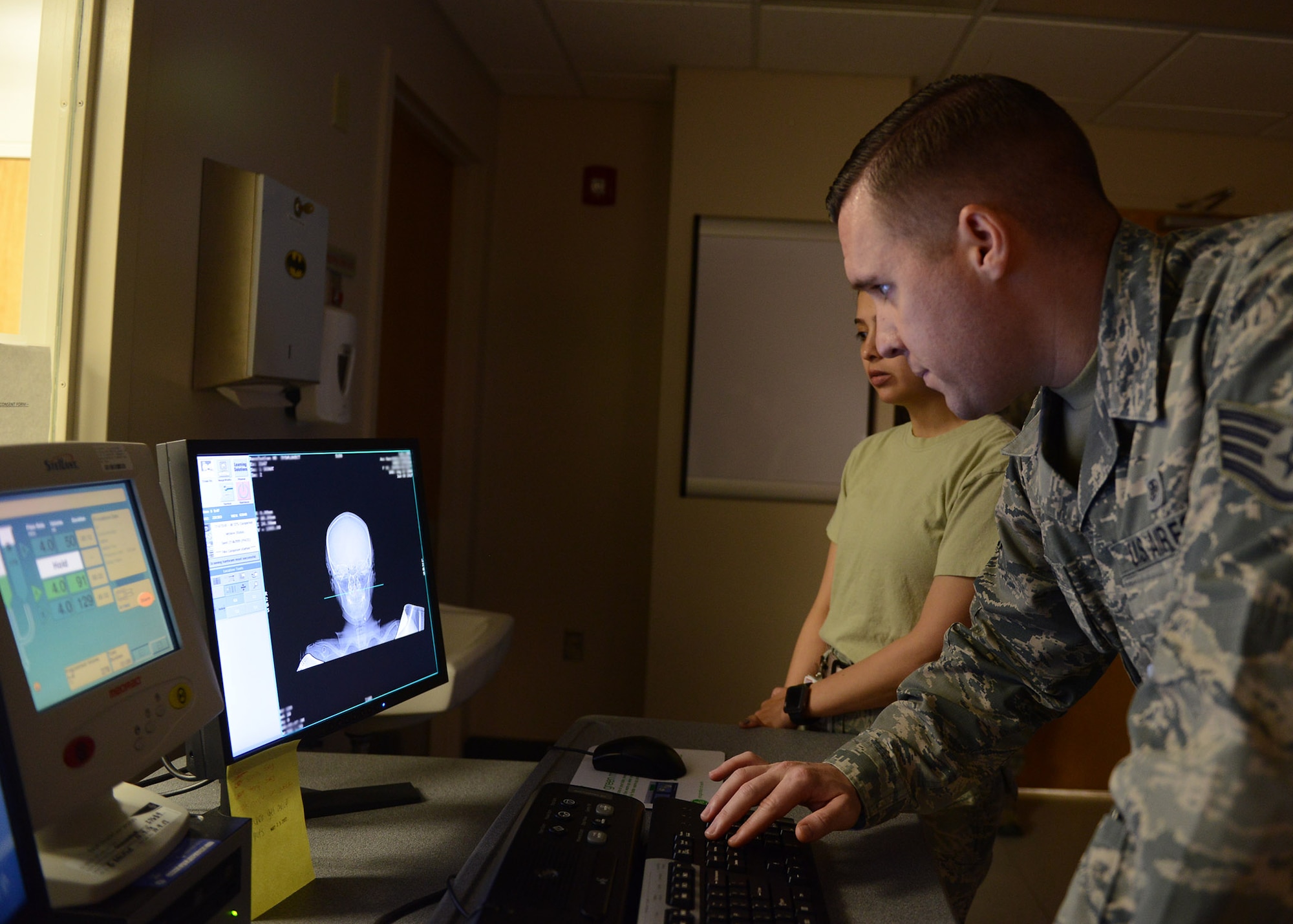 Staff Sgt. David Pegg, 56th Medical Support Squadron computed tomography technologist, reviews a CT scan June 5, 2017, at Luke Air Force Base, Ariz. CT scans differ from X-rays because they offer three dimensional images, showing tissue more in depth. (U.S. Air Force photo by Senior Airman James Hensley)