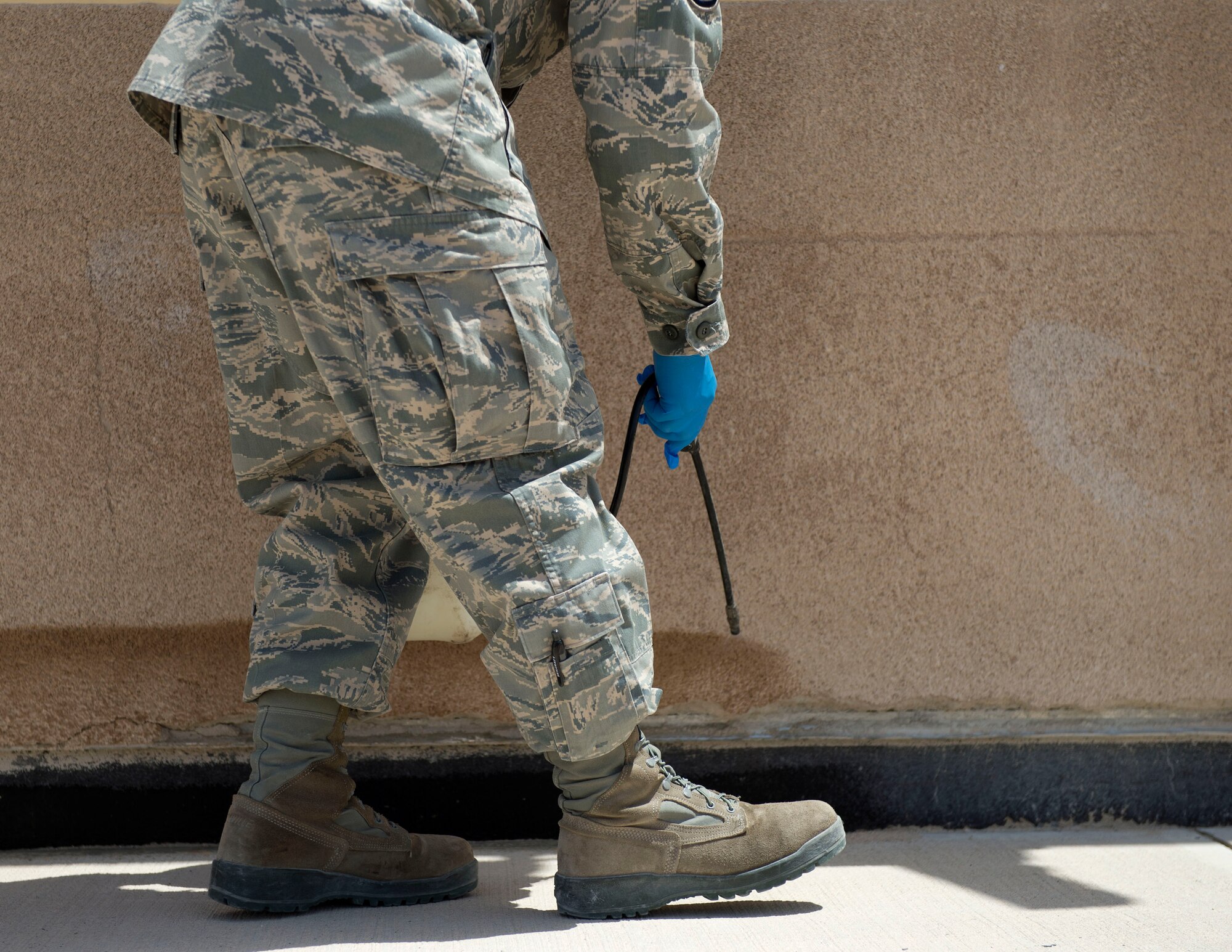 U.S. Air Force Master Sgt. Joseph Moore, non-commissioned officer in charge of pest management with the 379th Expeditionary Civil Engineer Squadron sprays insecticide around the perimeter of a building at Al Udeid Air Base, Qatar, May 30, 2017. Moore is part of a small team of airmen that keep the base free of pests which could carry infectious diseases in order to protect the health and safety of everyone on base. (U.S. Air Force photo by Tech. Sgt. Amy M. Lovgren)
