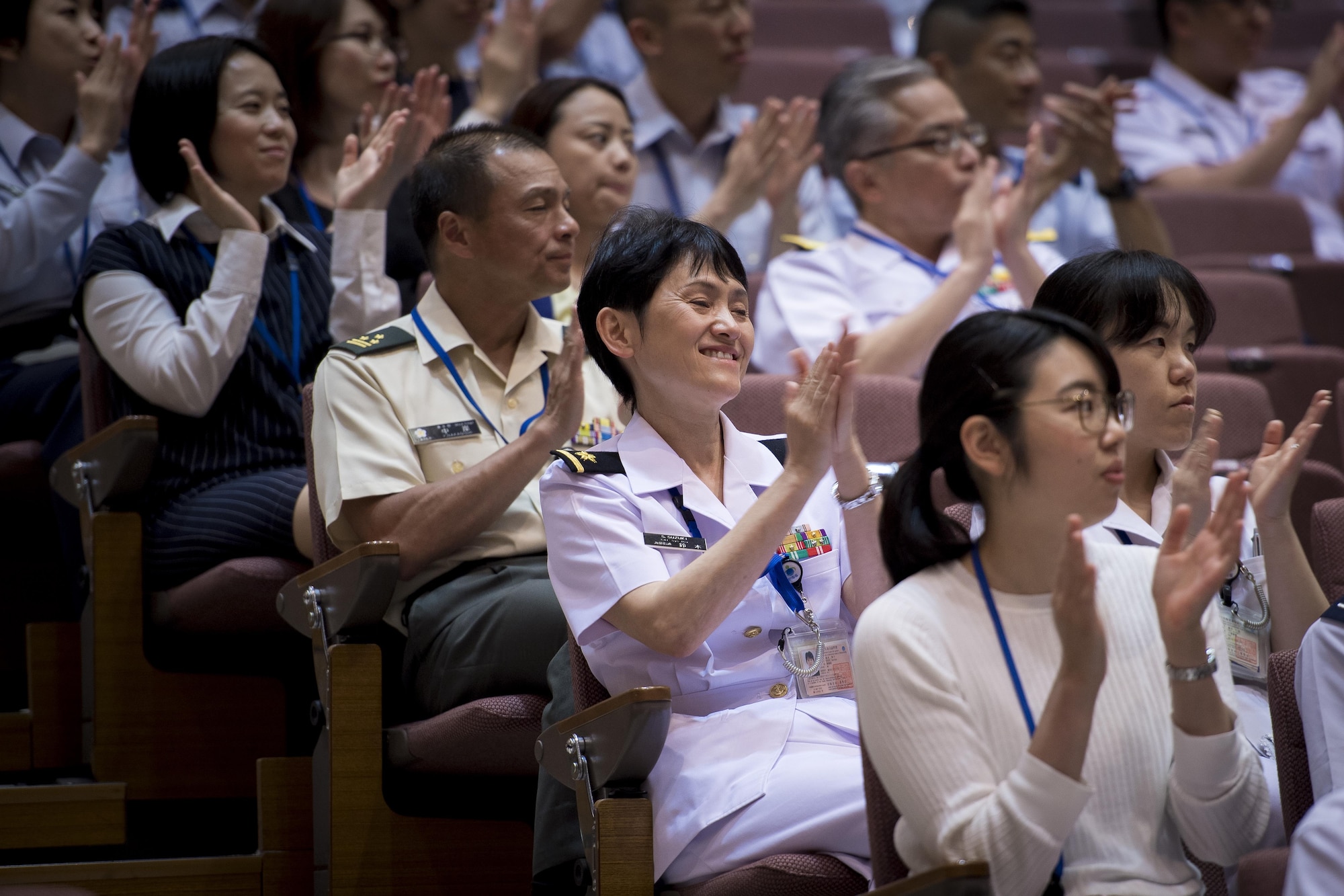 Audience members applaud the performance during a Joint Big Band Concert, June 7, 2017, at the Japanese Ministry of Defense, Tokyo, Japan. The Joint Big Band is scheduled to perform at local high schools in Tokyo to show how music can cross cultural barriers and demonstrate the cooperation and friendship between Japan and U.S. forces. (U.S. Air Force photo by Airman 1st Class Donald Hudson)