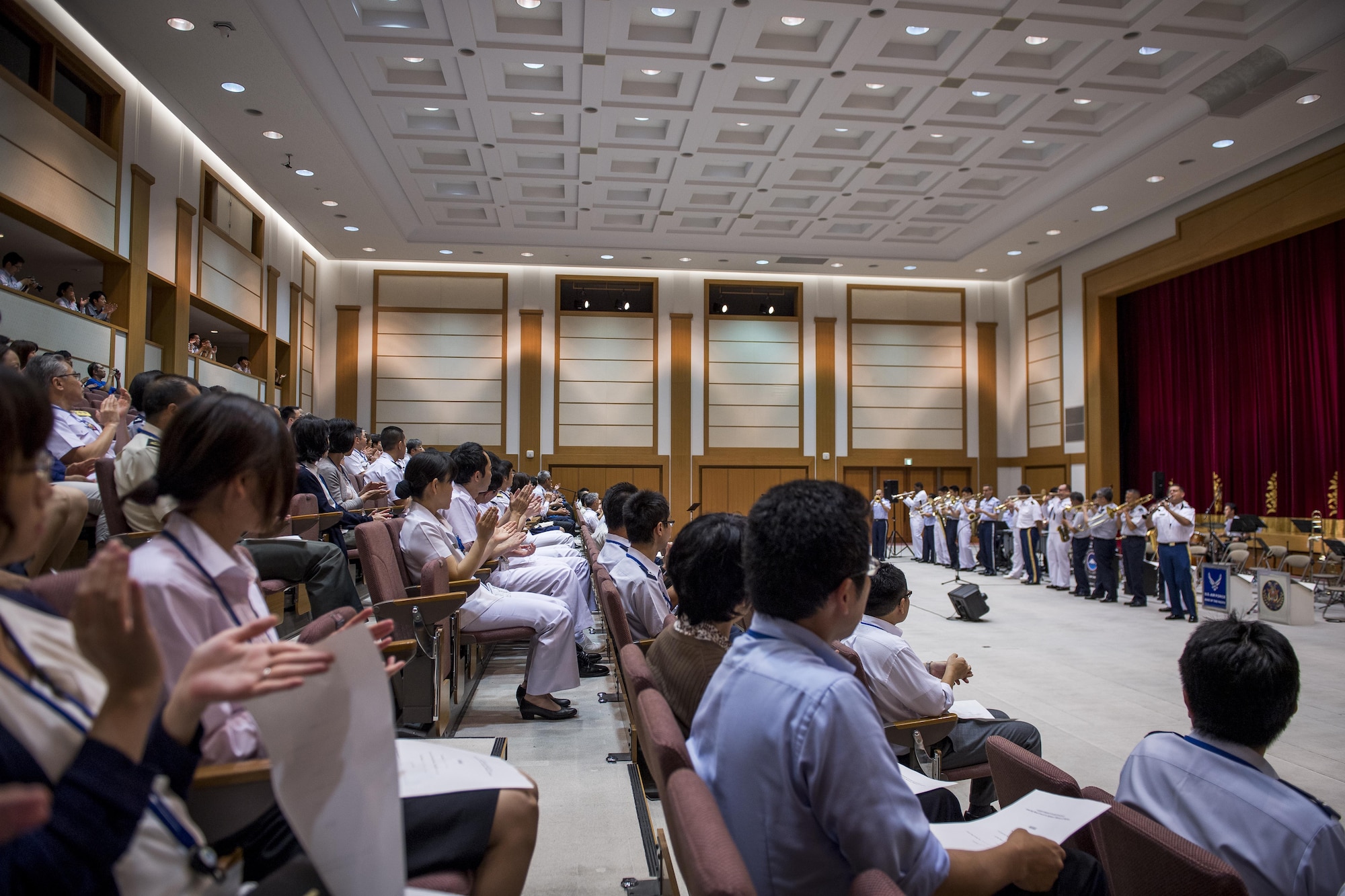 During a concert audience members clap along with the band as they play the song, “When the Saints Come Marching In,” June 7, 2017, at the Japanese Ministry of Defense, Tokyo, Japan. The Joint Big Band included 20 members of Japanese and U.S. forces from across five different bands: the Tokyo Band Sea Legs, Japan Air Self Defense Force Central Band, U.S. Army Japan Band Camp Zama, U.S. Navy 7th Fleet Band and the U.S. Air Force Band of the Pacific. (U.S. Air Force photo by Airman 1st Class Donald Hudson)
