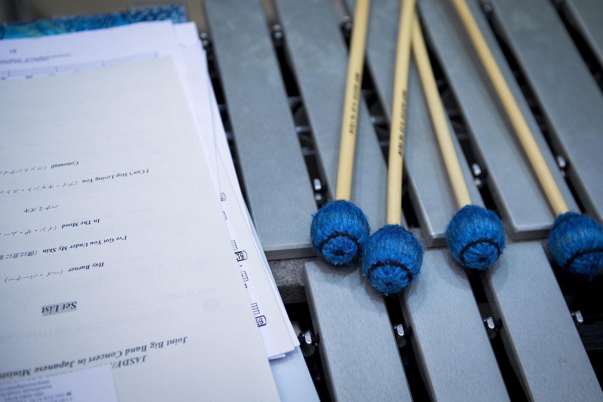 Drum sticks and a set list rest on a xylophone after a Joint Big Band concert, June 7, 2017, at the Japanese Ministry of Defense, Tokyo, Japan. The concert marked the first time five separate bands from Japan and U.S. forces have come together as one. By highlighting the strong alliance and friendship shared between the Japanese and U.S. forces, the concert demonstrated how music can help strengthen cultural ties. (U.S. Air Force photo by Airman 1st Class Donald Hudson)