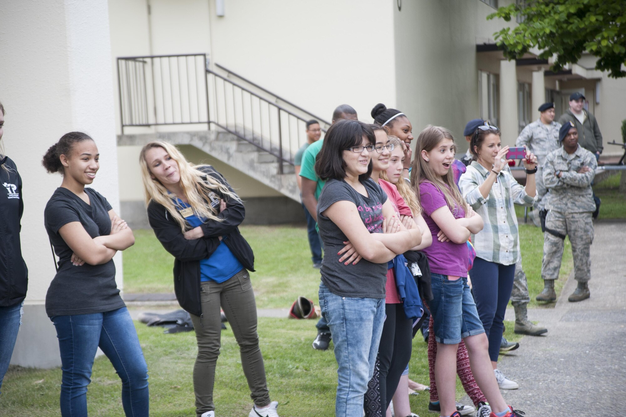 Youth from the Misawa Teen Center watched as U.S. Air Force Staff Sgt. Charles Sena, a 35th Security Forces Squadron military working dog handler, demonstrates MWD Karo’s skills at Misawa Air Base, Japan, June 8, 2017. The focus of the event was to teach teens about weapons 35th SFS members use, the MWD section and what they do on a day-to-day basis. (U.S. Air Force photo by Staff Sgt. Melanie A. Hutto)