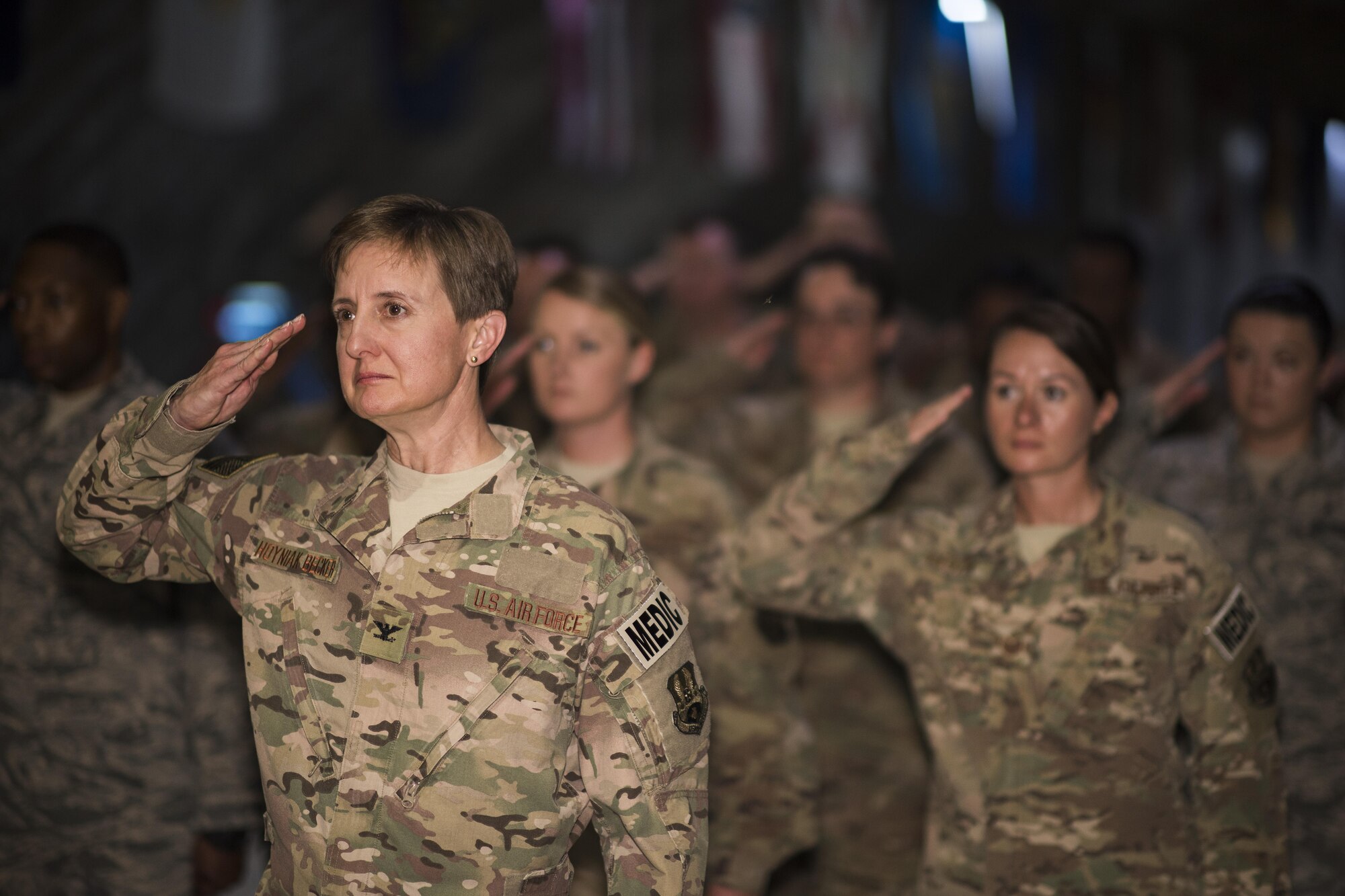Members of the 332nd Expeditionary Medical Group render a salute to their new commander during a change of command ceremony June 3, 2017, in Southwest Asia. The ceremony was held to recognize Col. Joseph V. Hale as the new commander of the 332nd EMDG. (U.S. Air Force photo/Senior Airman Damon Kasberg)