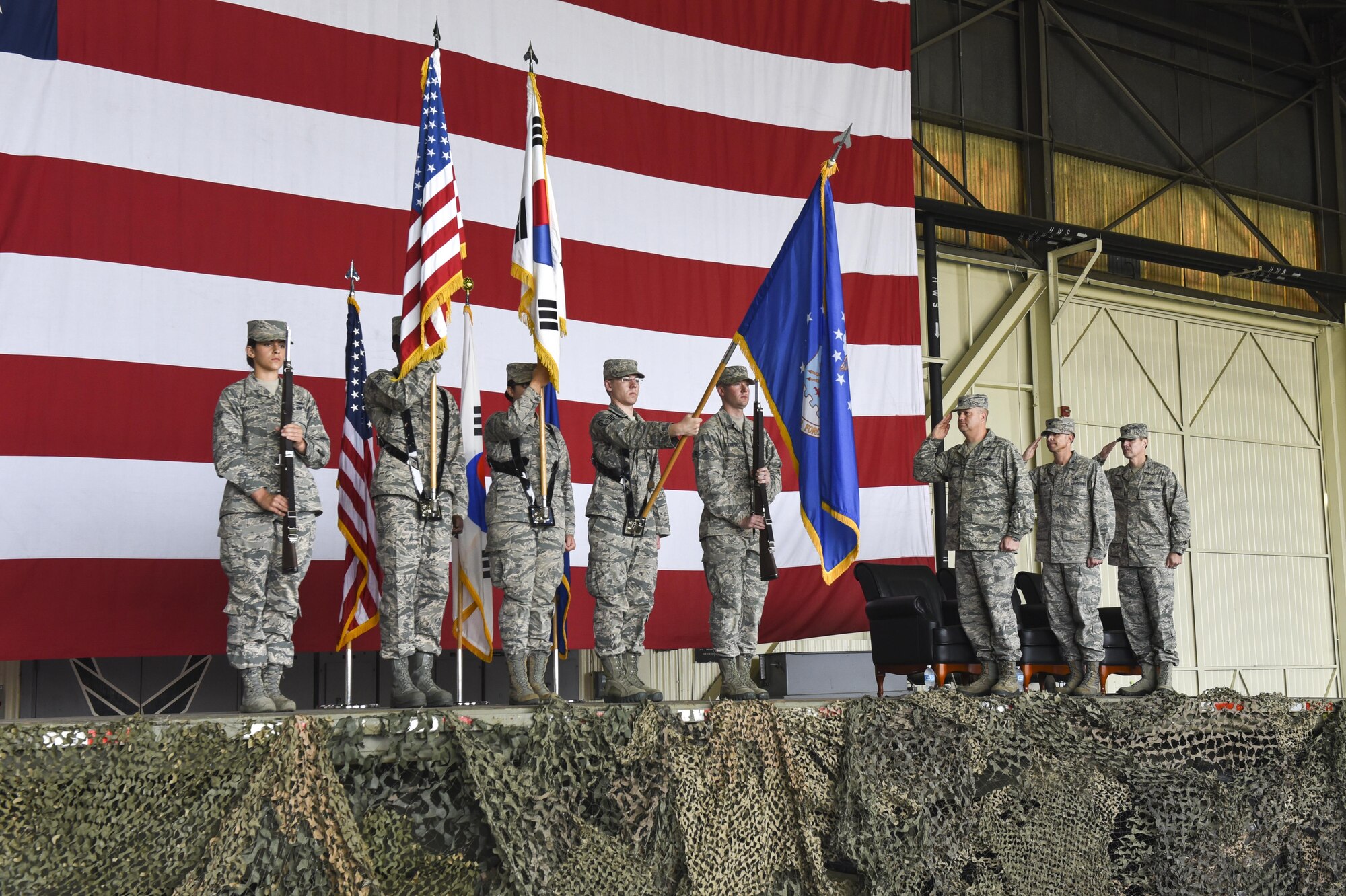 U.S. Air Force Col. David Shoemaker, 8th Fighter Wing commander, Col. Richard McKee, 8th Mission Support Group outgoing commander, and Col. Michael Zuhlsdorf, 8th MSG incoming commander, salute during a change of command ceremony at Kunsan Air Base, Republic of Korea, June 8, 2017. During the ceremony Col. Richard McKee relinquished command of the 8th MSG to Col. Michael Zuhlsdorf. (U.S. Air Force photo by Senior Airman Michael Hunsaker/Released)