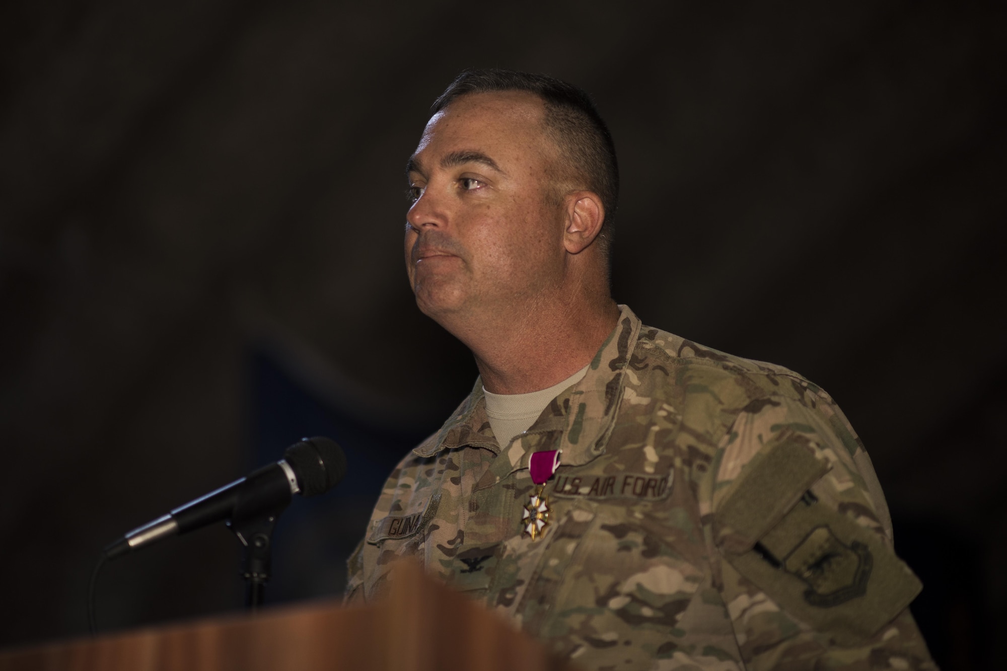 Col. Daniel A. Guinan, 332nd Expeditionary Mission Support Group commander, gives a speech during a change of command ceremony June 4, 2017, in Southwest Asia. Guinan was presented the Legion of Merit for his accomplishment while leading the 332nd EMSG. (U.S. Air Force photo/Senior Airman Damon Kasberg)