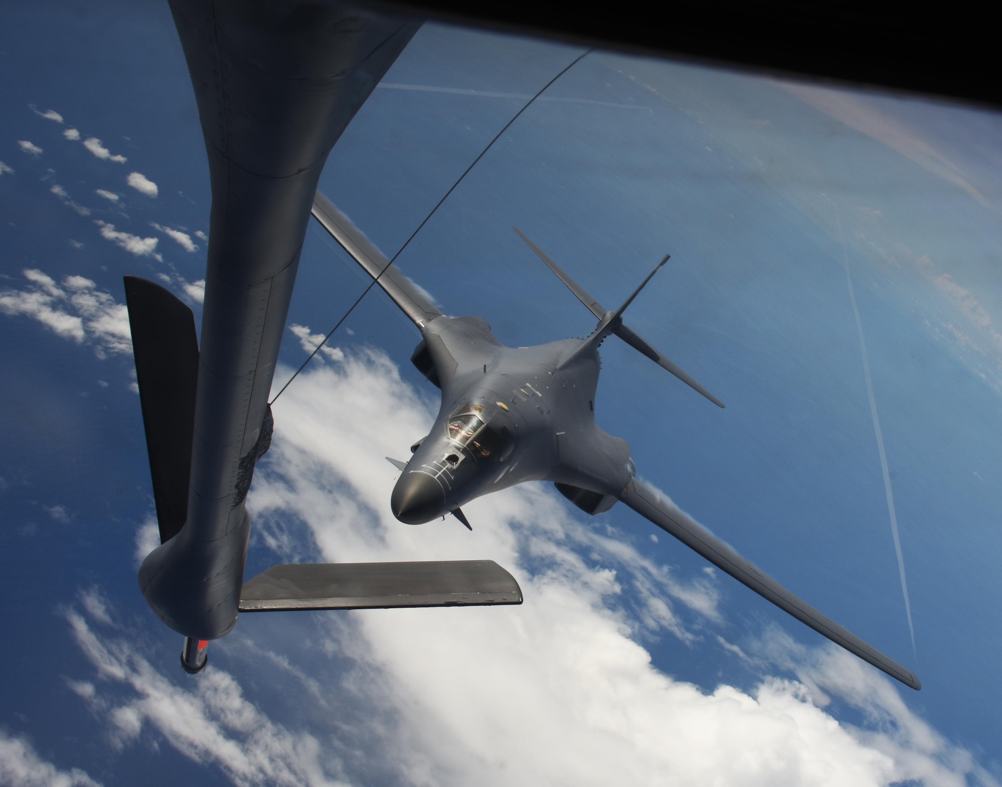 Two U.S. Air Force B-1B Lancers assigned to the 9th Expeditionary Bomb Squadron, deployed from Dyess Air Force Base, Texas, fly a 10-hour mission from Andersen Air Force Base, Guam, through the South China Sea, operating with the U.S. Navy's Arleigh Burke-class guided-missile destroyer USS Sterett (DDG 104), June 8, 2017. The joint training, organized under Pacific Command's continuous bomber presence program (CBP), allows the Air Force and Navy to increase interoperability by refining joint tactics, techniques and procedures while simultaneously strengthening their ability to seamlessly integrate their operations. (U.S. Air Force photo/Tech. Sgt. Richard P. Ebensberger)